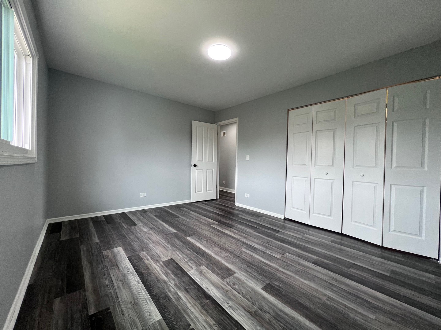 1170 Singleton Drive Roselle, IL 60172 - Photo 24 of 42 a view of an empty room and wooden floor
