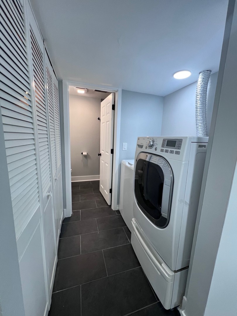 1170 Singleton Drive Roselle, IL 60172 - Photo 35 of 42 a view of a hallway with washer and dryer