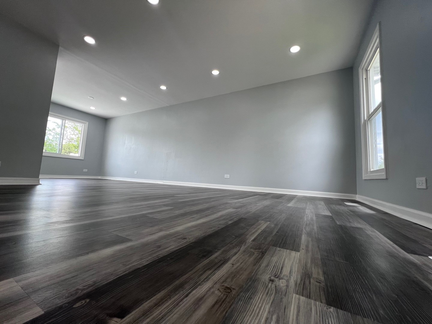 1170 Singleton Drive Roselle, IL 60172 - Photo 9 of 42 an empty room with wooden floor and windows