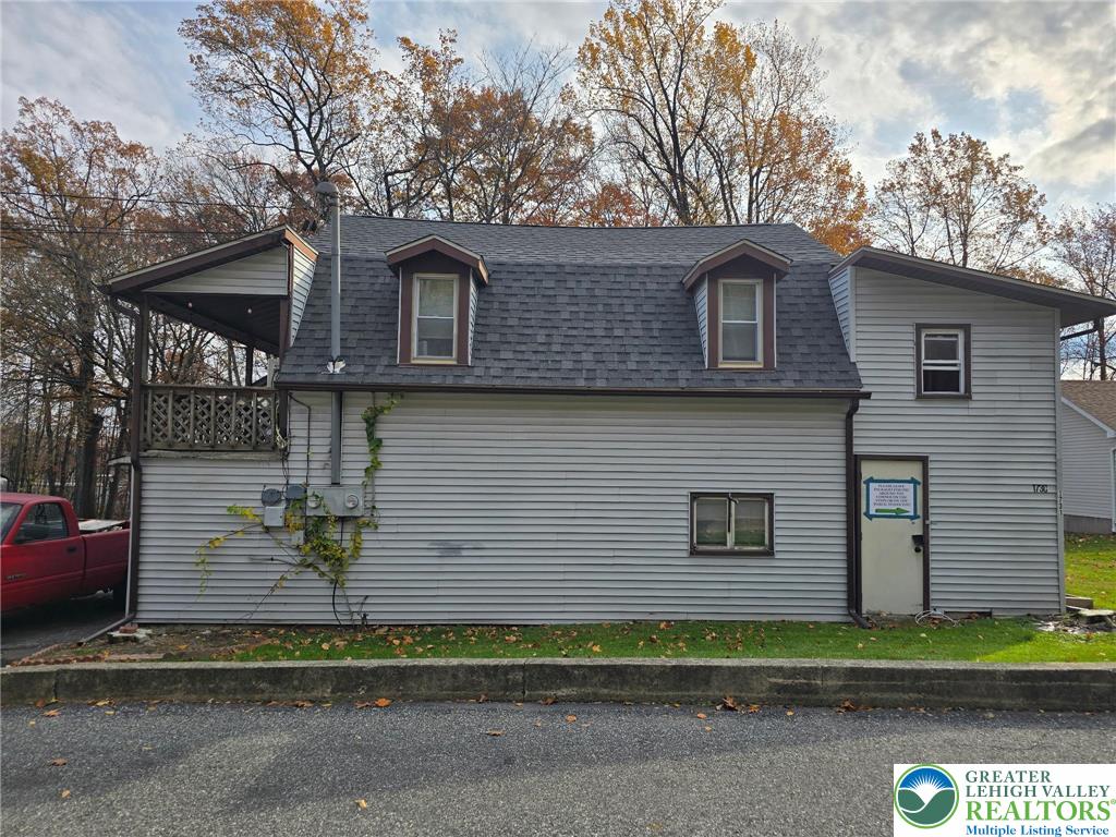 1731 West 8th Street Wind Gap, PA 18091 - Photo 4 of 13 a front view of a house with a yard