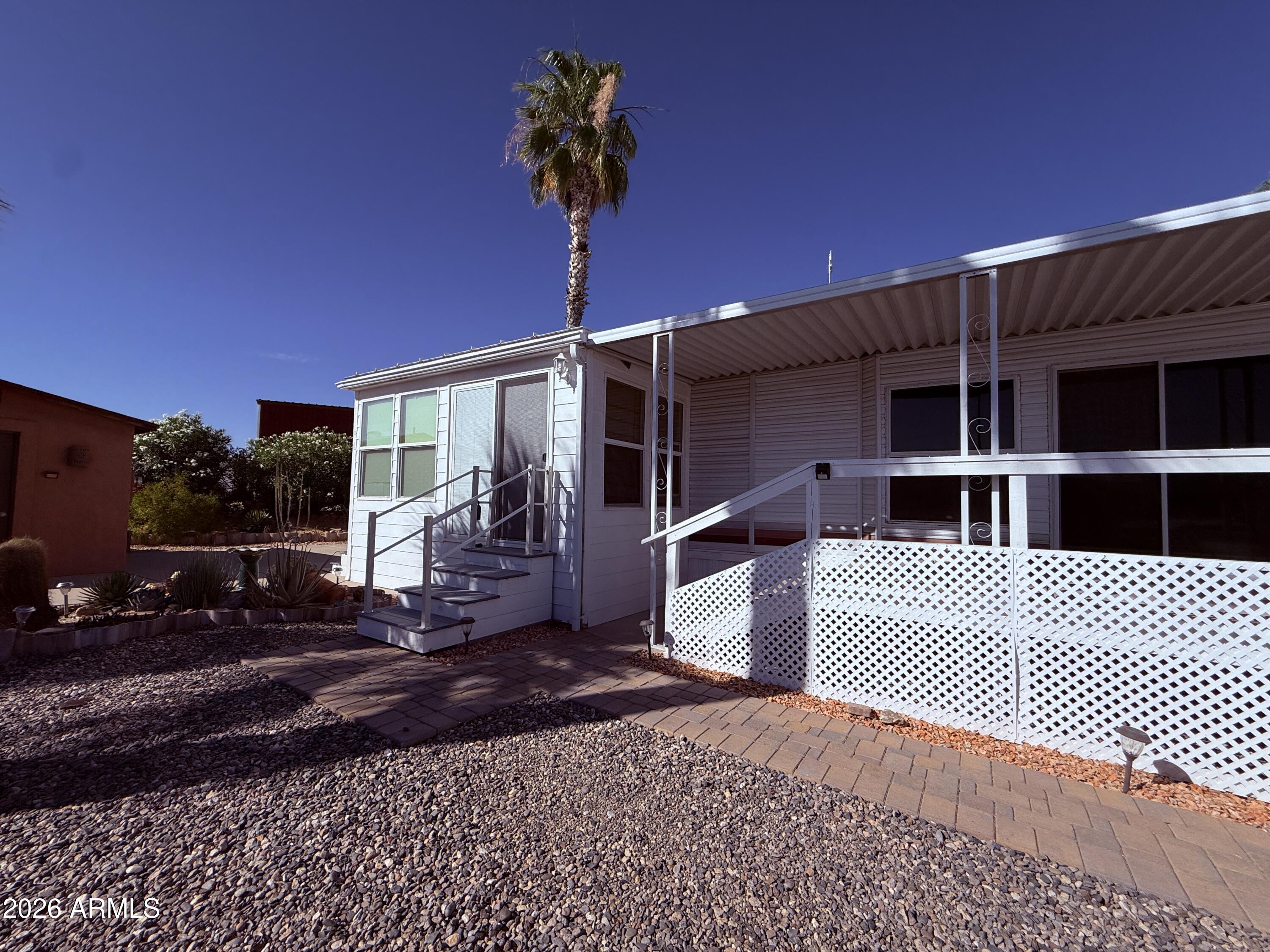 21340 Trading Post Trail Congress, AZ 85332 - Photo 21 of 31 a front view of a house with a yard