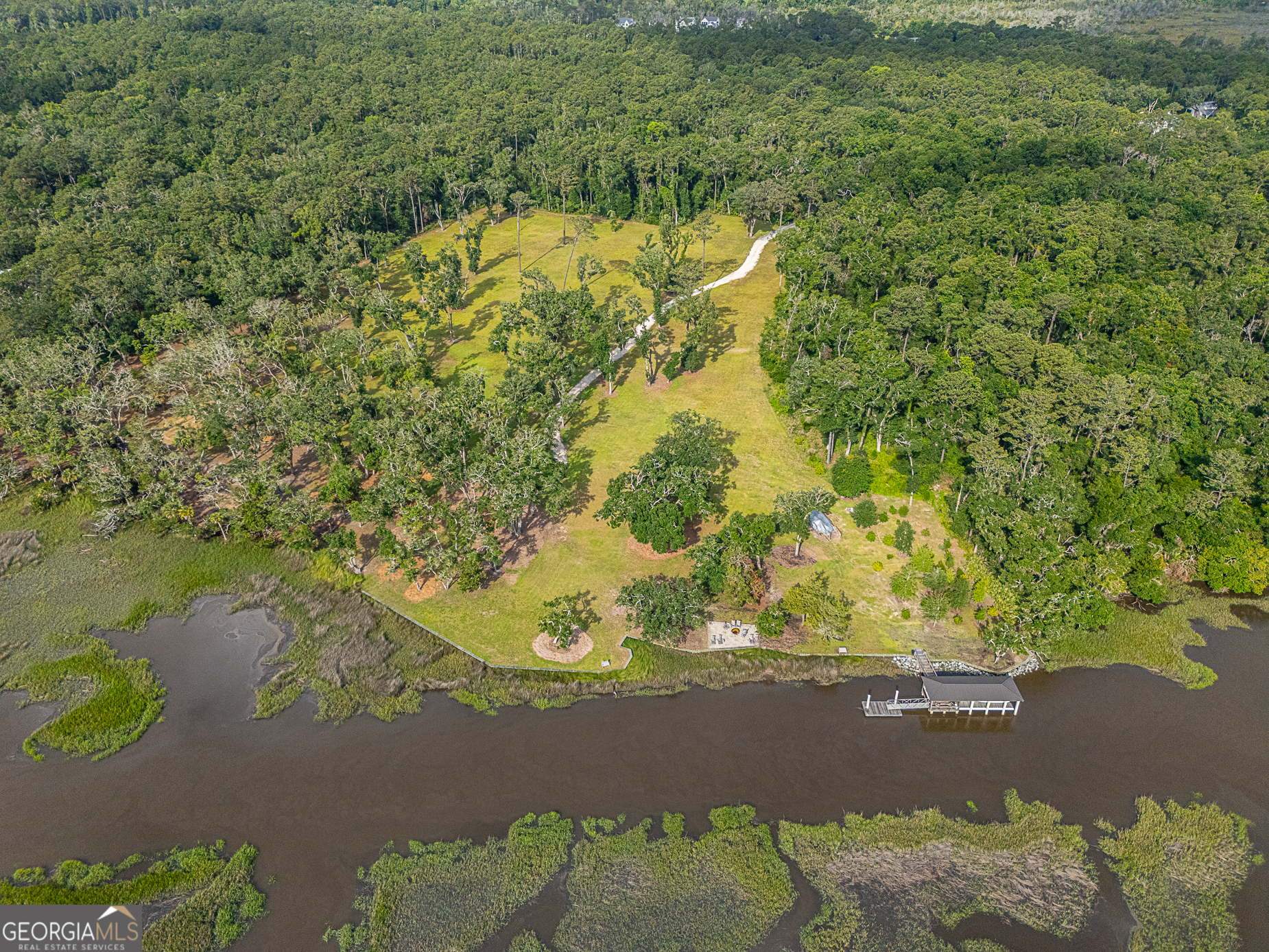 24 Carriage Drive St. Simons Island, GA 31522 - Photo 15 of 67 a view of a lake