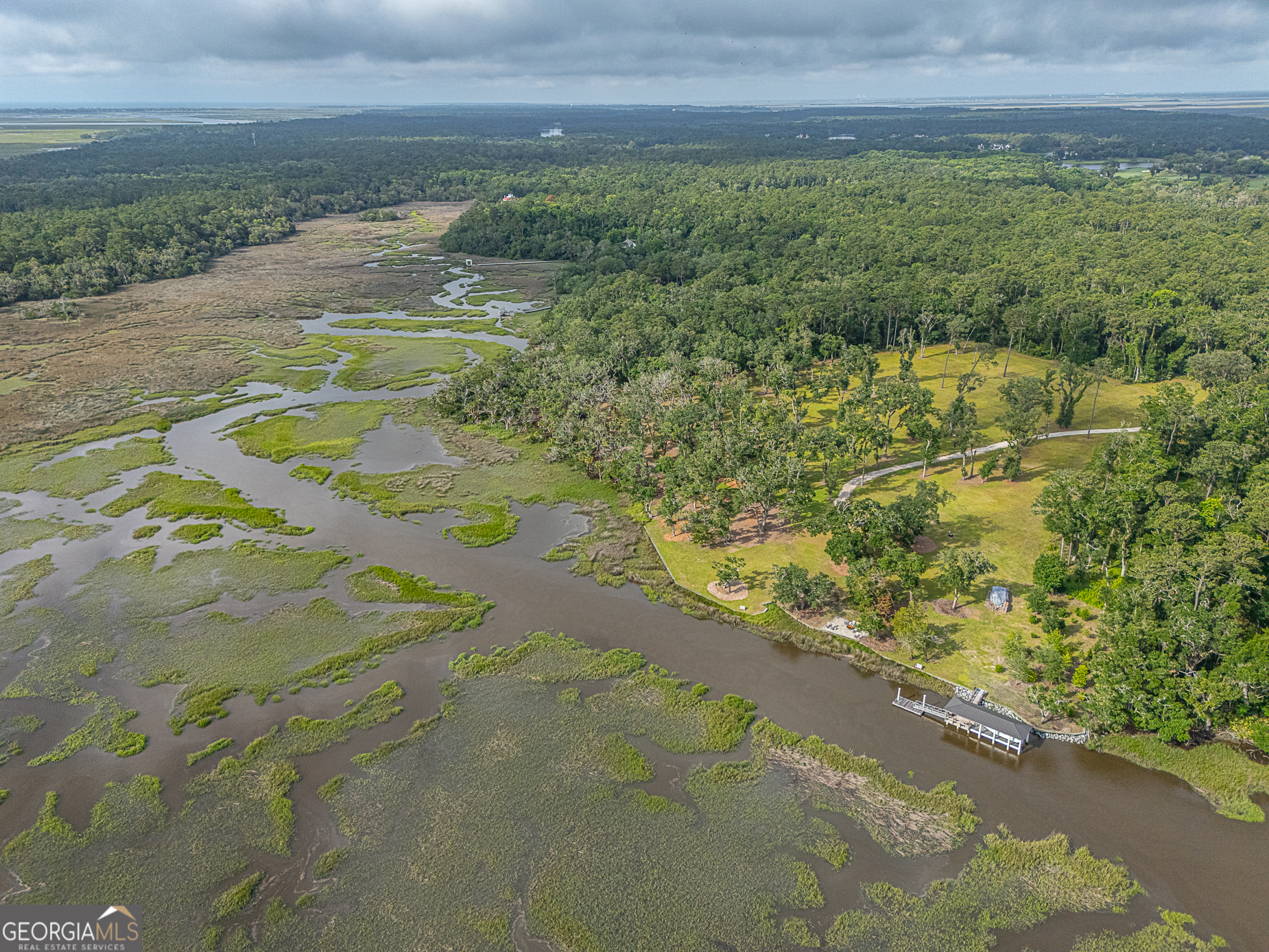 24 Carriage Drive St. Simons Island, GA 31522 - Photo 21 of 67 a view of a field with an trees