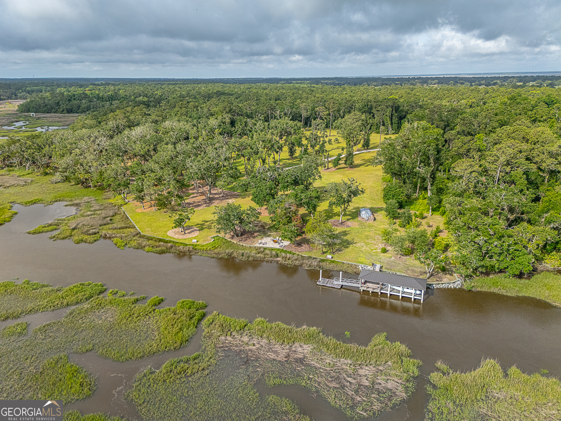 24 Carriage Drive St. Simons Island, GA 31522 - Photo 22 of 67 a view of an ocean from a yard