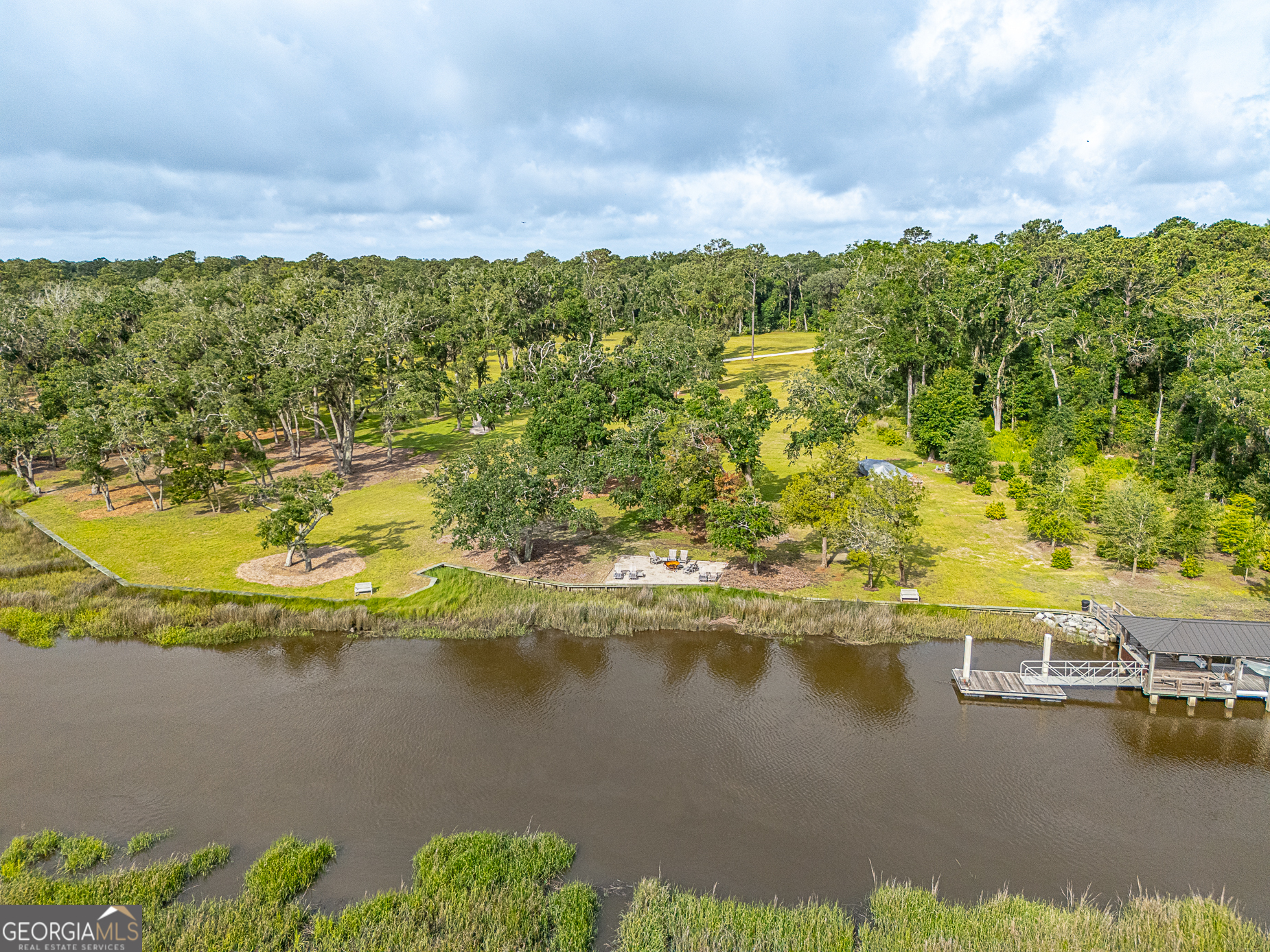 24 Carriage Drive St. Simons Island, GA 31522 - Photo 24 of 67 a view of a lake with a mountain