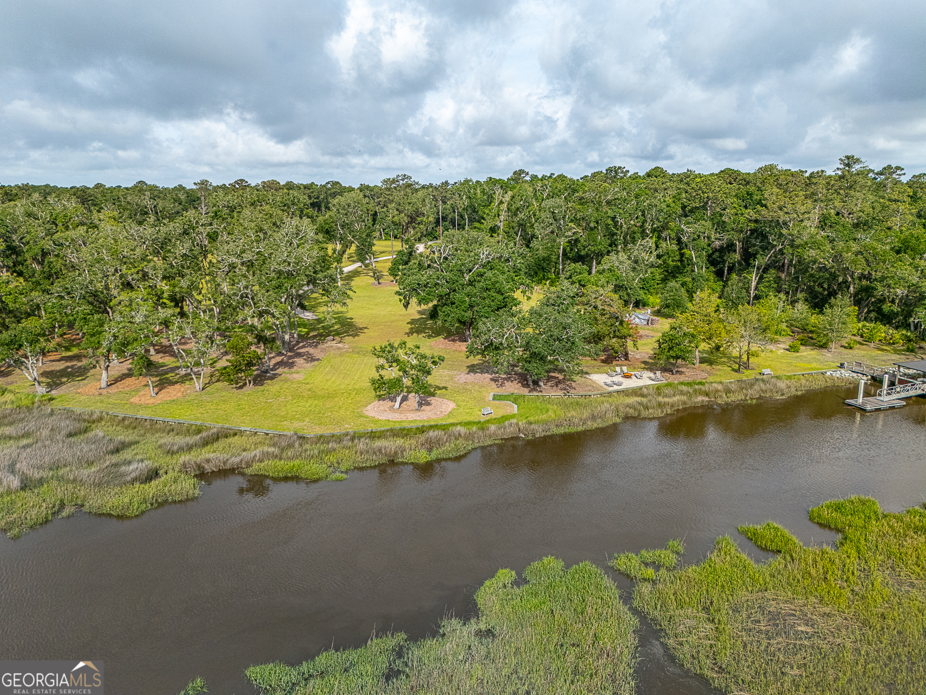 24 Carriage Drive St. Simons Island, GA 31522 - Photo 25 of 67 a view of a lake with a mountain
