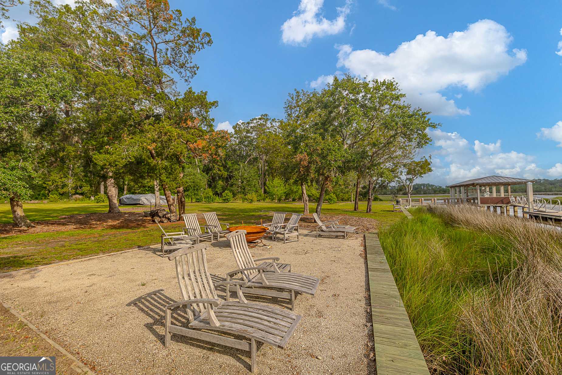 24 Carriage Drive St. Simons Island, GA 31522 - Photo 46 of 67 a view of a swimming pool with a patio
