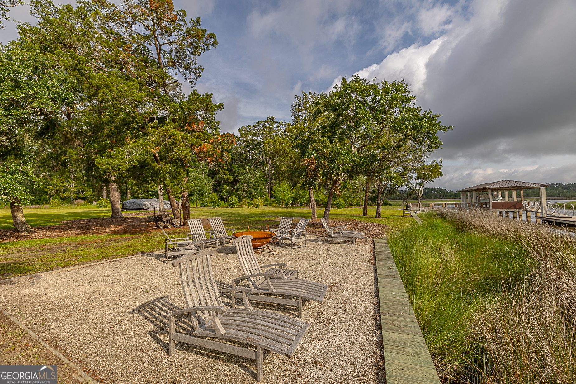 24 Carriage Drive St. Simons Island, GA 31522 - Photo 47 of 67 a view of a swimming pool with a patio