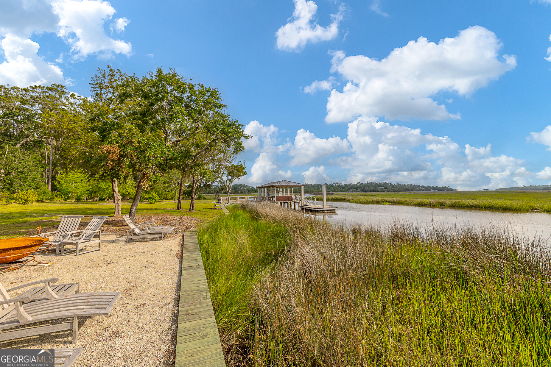 24 Carriage Drive St. Simons Island, GA 31522 - Photo 48 of 67 a view of a lake with outdoor space