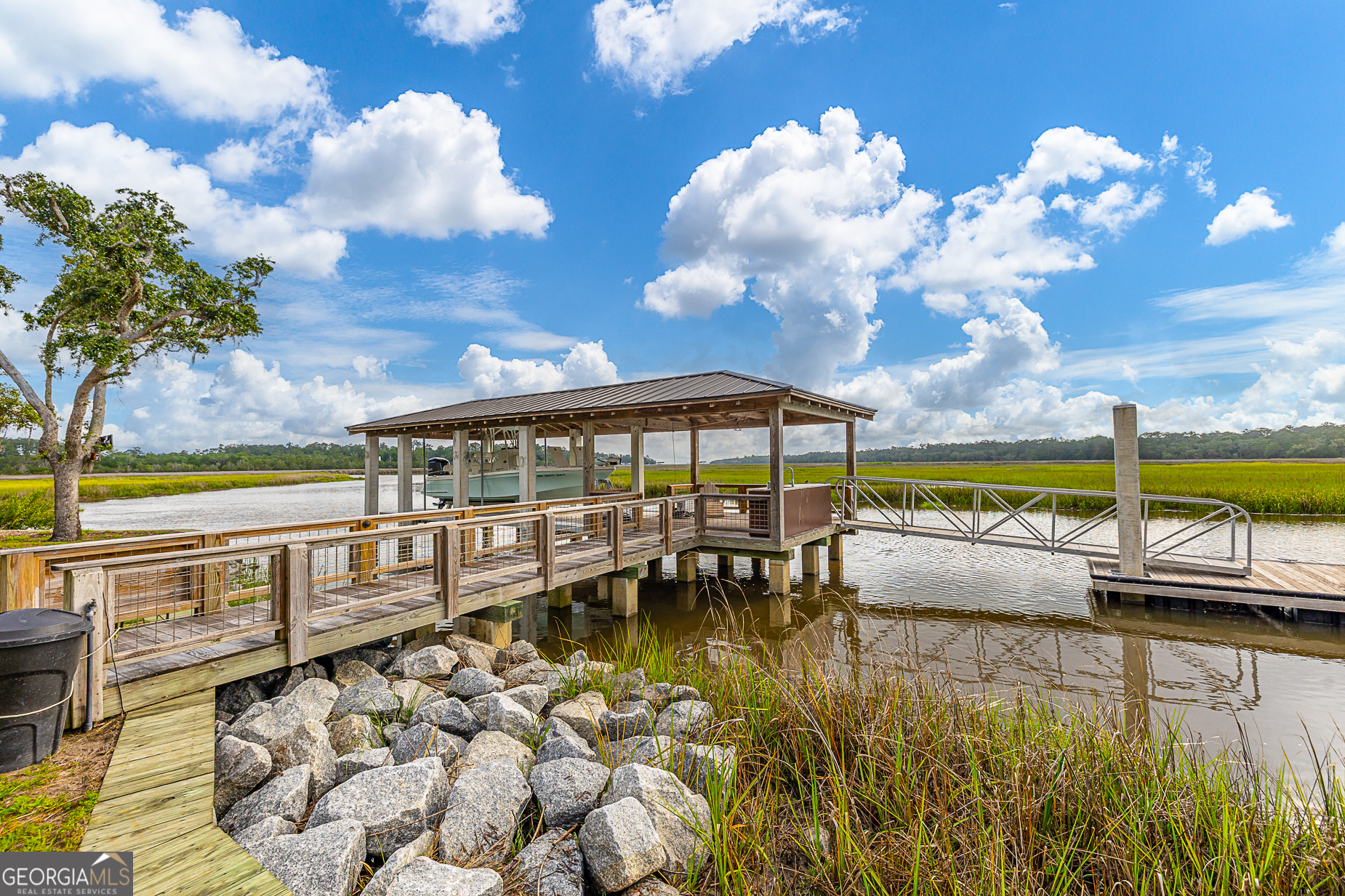 24 Carriage Drive St. Simons Island, GA 31522 - Photo 53 of 67 a view of a swimming pool with a patio
