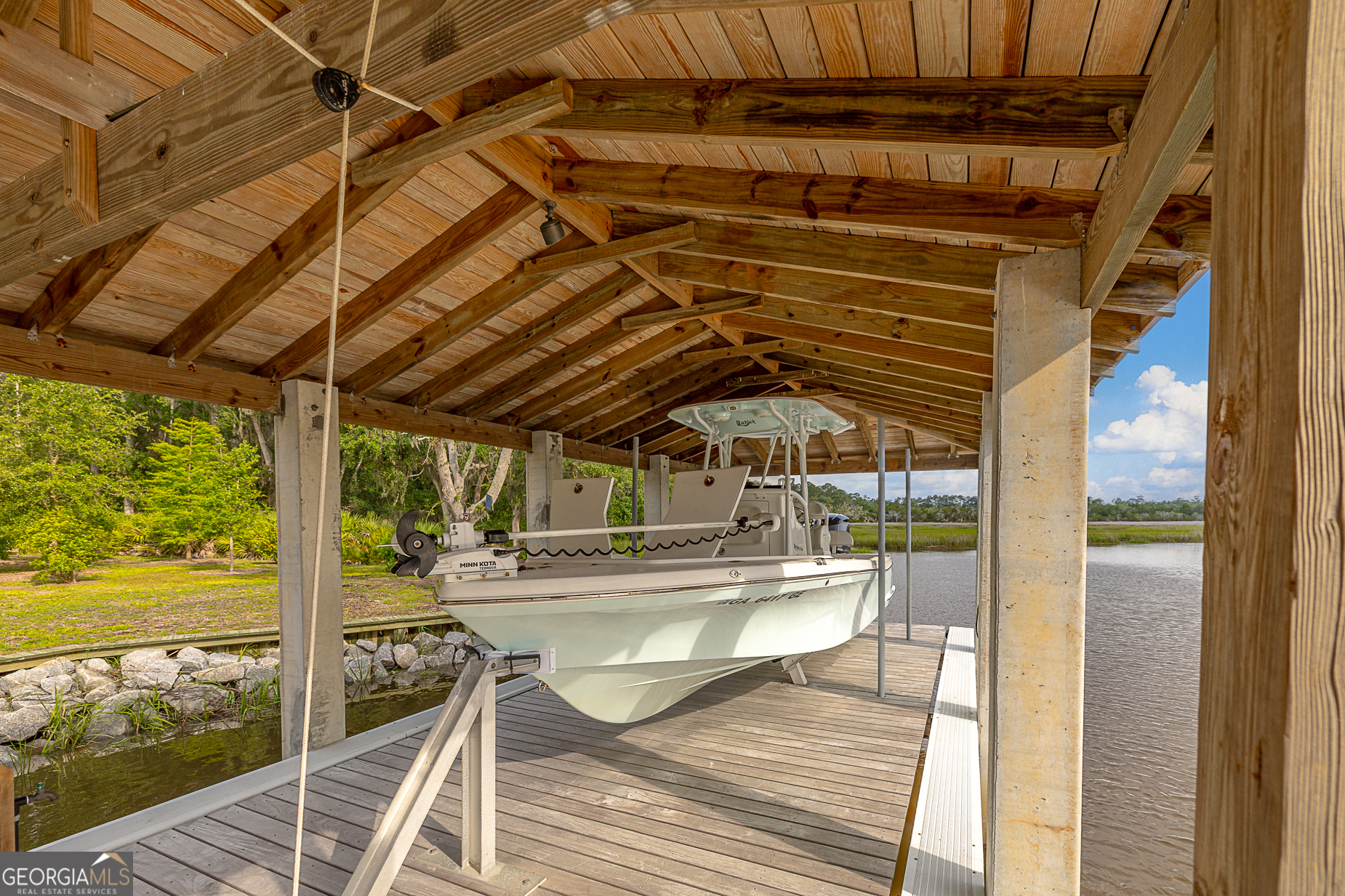 24 Carriage Drive St. Simons Island, GA 31522 - Photo 57 of 67 a view of a swimming pool with a patio