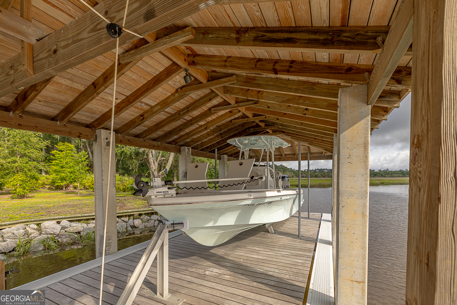 24 Carriage Drive St. Simons Island, GA 31522 - Photo 58 of 67 a view of a swimming pool with a patio