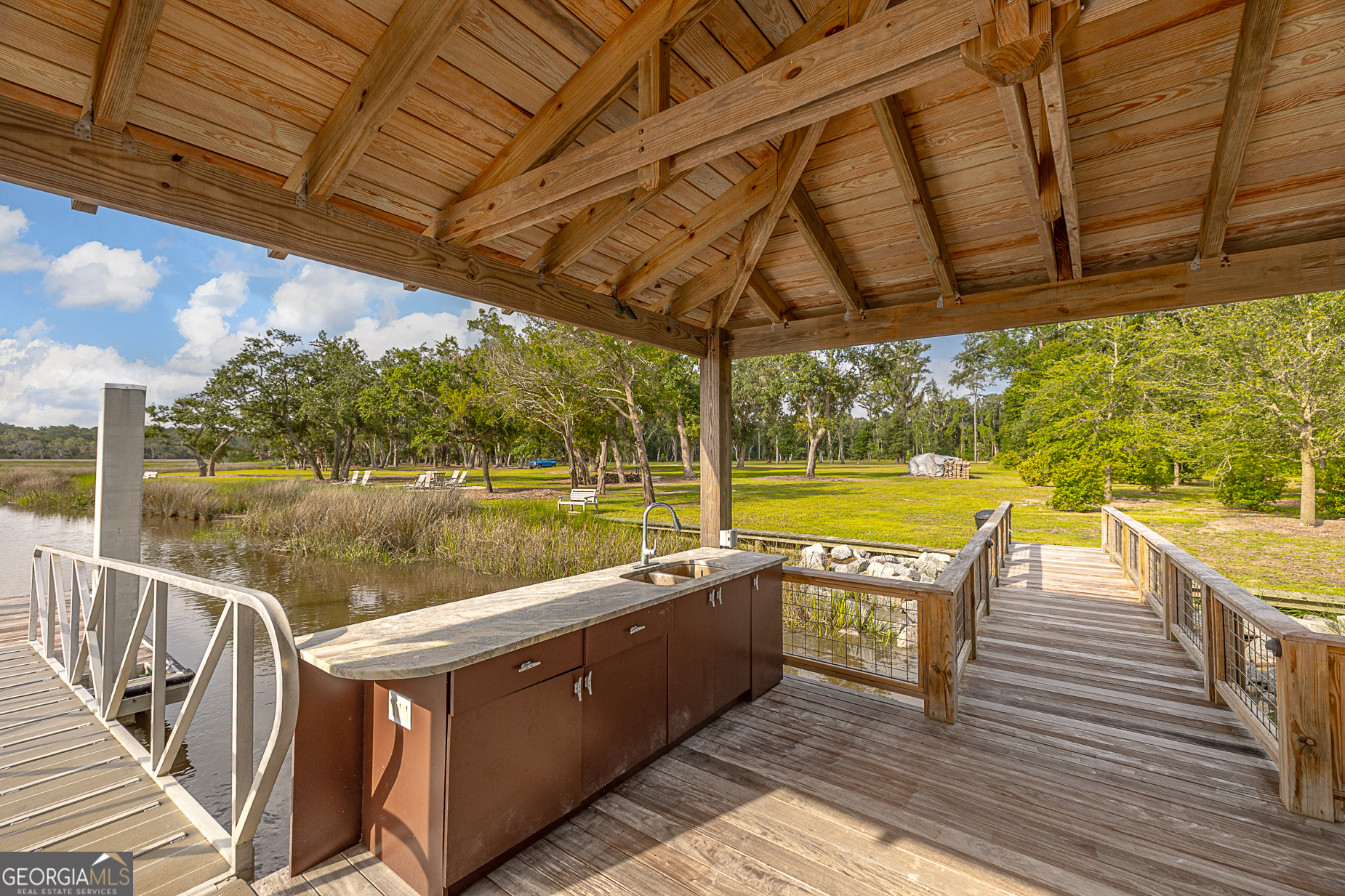 24 Carriage Drive St. Simons Island, GA 31522 - Photo 59 of 67 a view of a swimming pool with a patio
