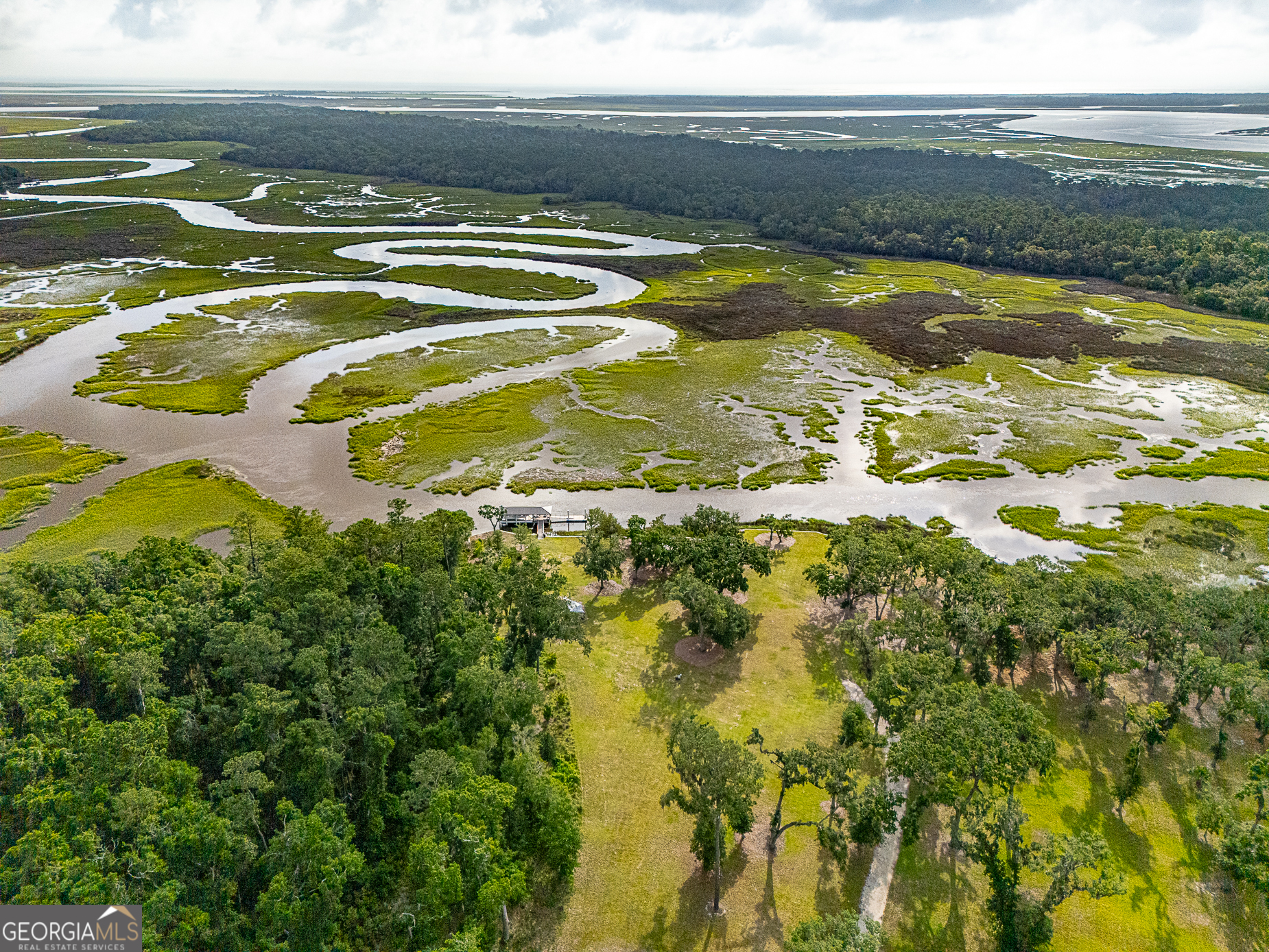 24 Carriage Drive St. Simons Island, GA 31522 - Photo 7 of 67 a view of an ocean and beach