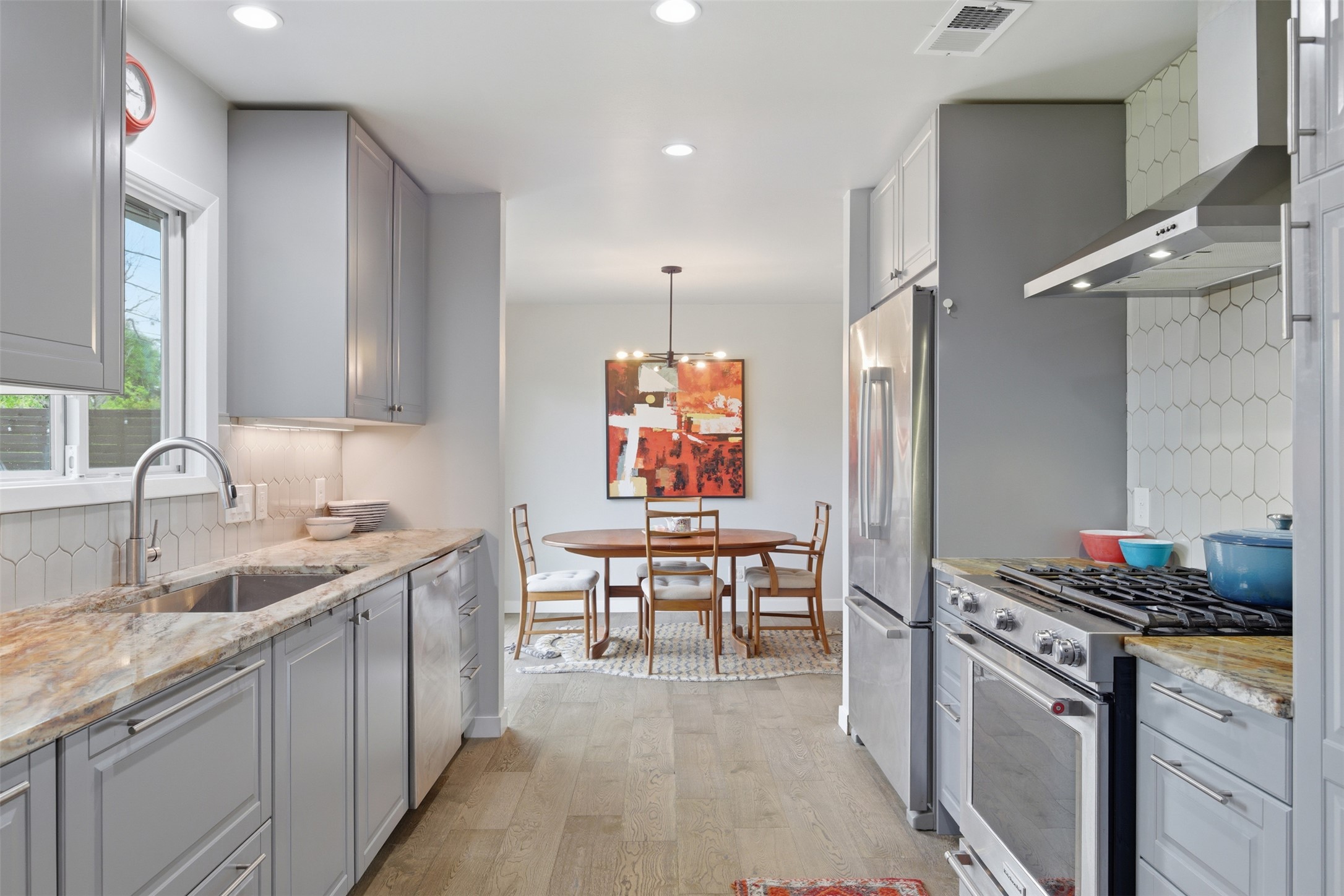 3208 Yellowpine Terrace Austin, TX 78757 - Photo 19 of 35 a kitchen with a sink cabinets and window