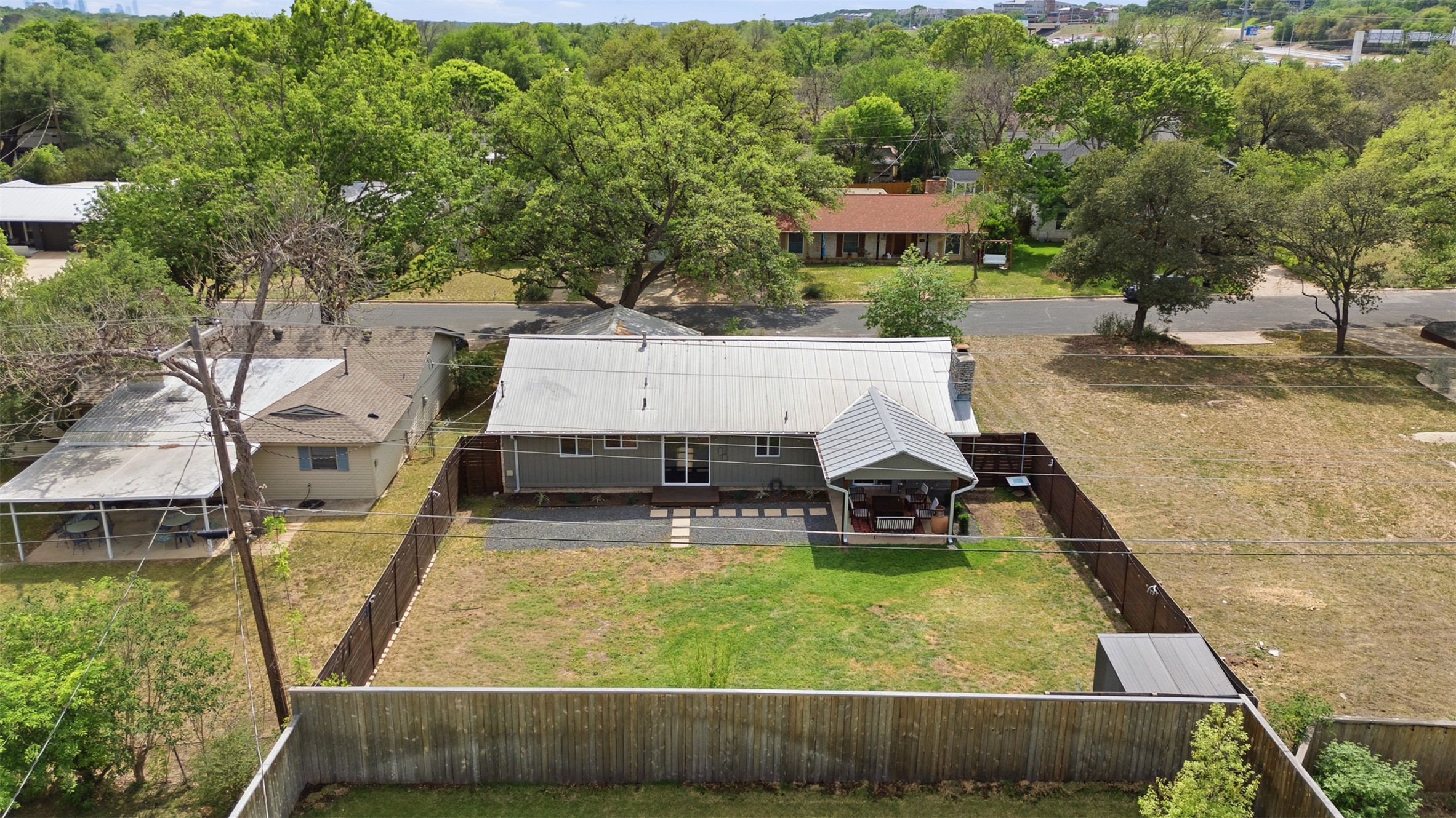 3208 Yellowpine Terrace Austin, TX 78757 - Photo 31 of 35 an aerial view of a house with swimming pool and large trees