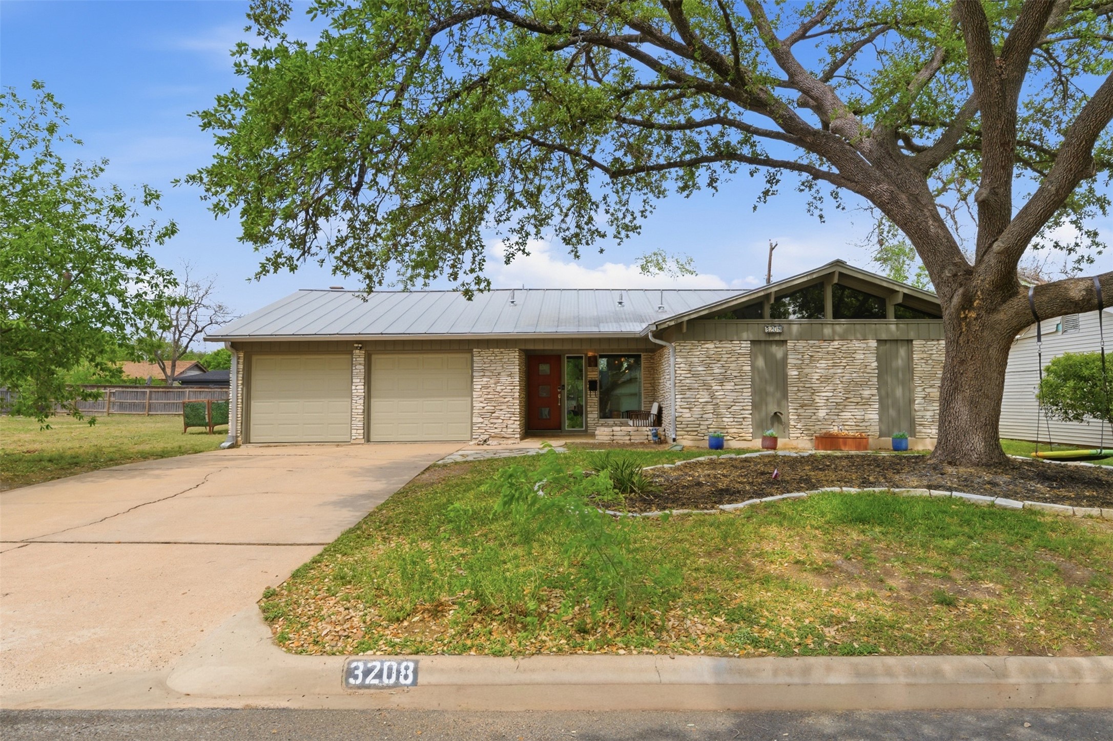 3208 Yellowpine Terrace Austin, TX 78757 - Photo 7 of 35 a front view of a house with garden