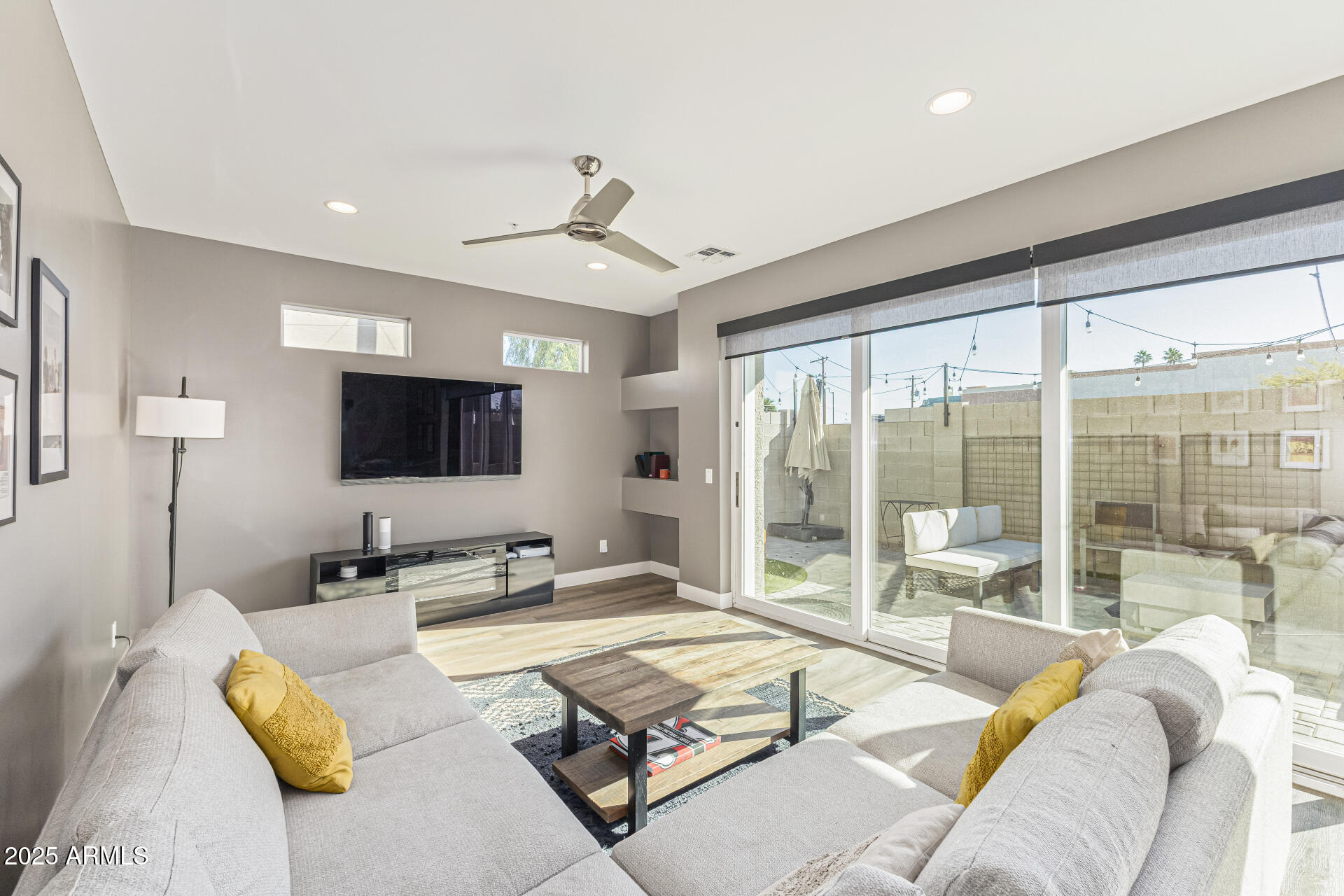 2315 East Pinchot Avenue, Unit 113 Phoenix, AZ 85016 - Photo 11 of 54 a living room with furniture and a flat screen tv