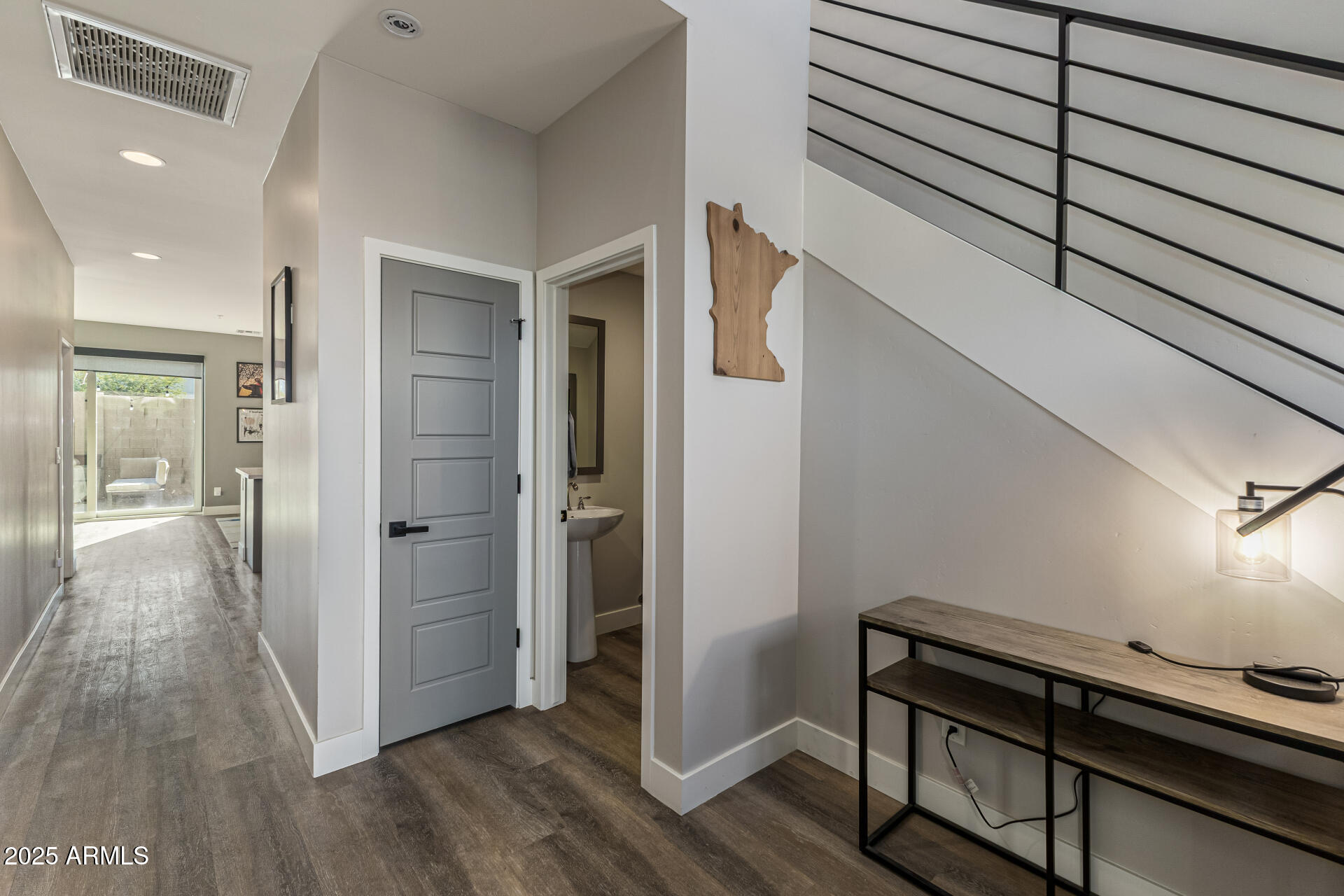 2315 East Pinchot Avenue, Unit 113 Phoenix, AZ 85016 - Photo 12 of 54 a view of a hallway with wooden floor and staircase