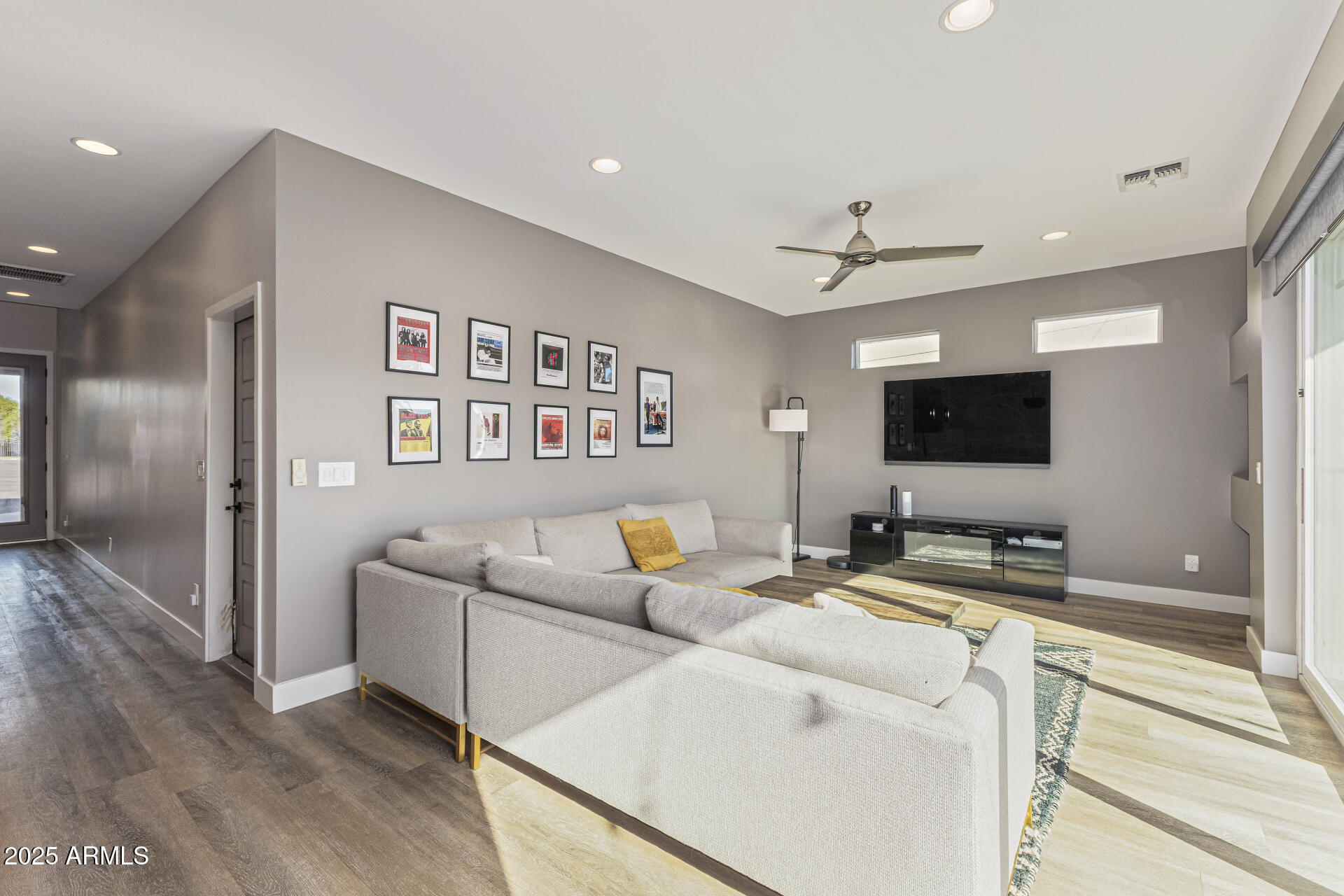 2315 East Pinchot Avenue, Unit 113 Phoenix, AZ 85016 - Photo 13 of 54 a living room with furniture and a flat screen tv