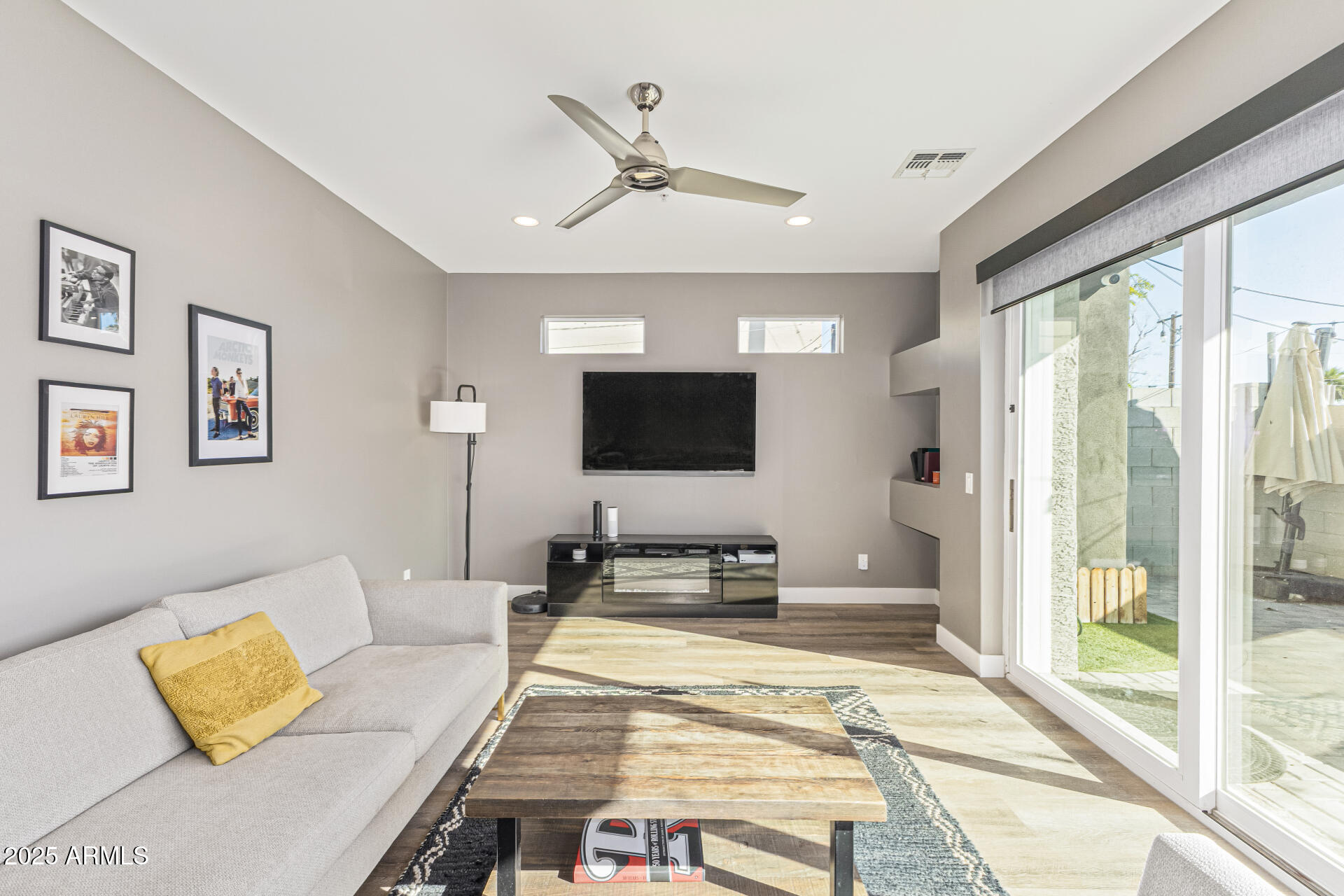 2315 East Pinchot Avenue, Unit 113 Phoenix, AZ 85016 - Photo 14 of 54 a living room with furniture and a flat screen tv