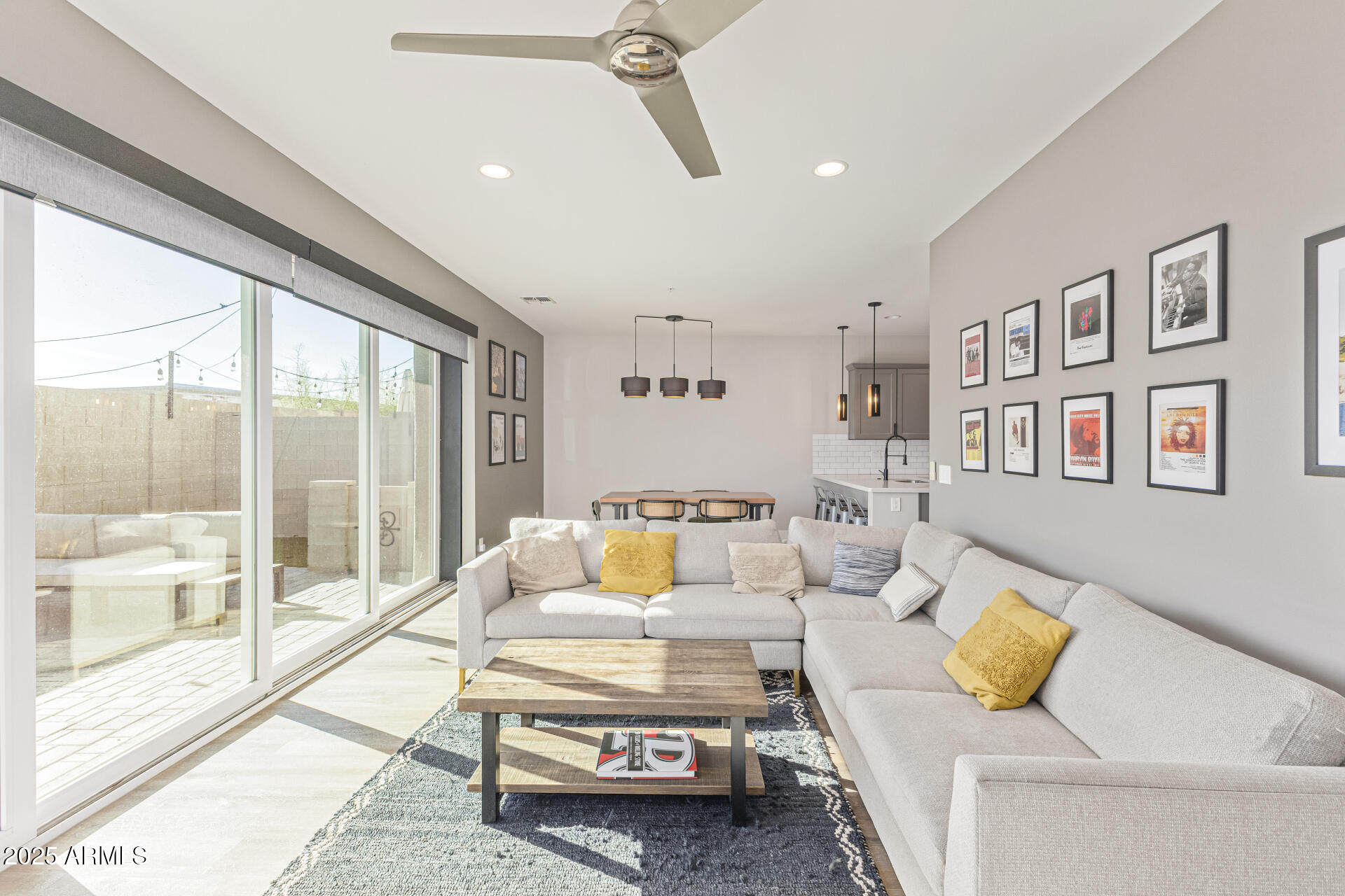 2315 East Pinchot Avenue, Unit 113 Phoenix, AZ 85016 - Photo 15 of 54 a living room with furniture and a floor to ceiling window