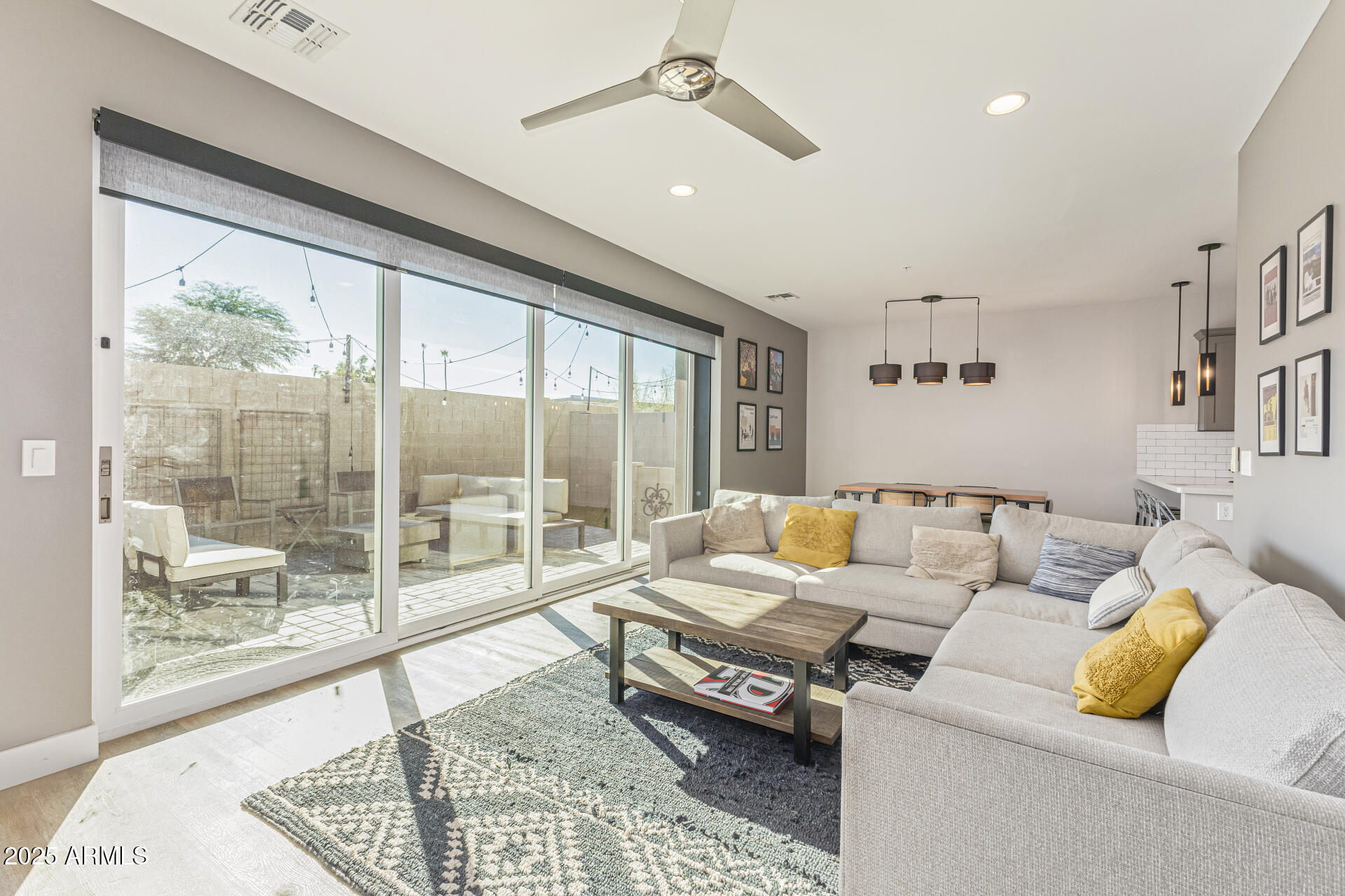 2315 East Pinchot Avenue, Unit 113 Phoenix, AZ 85016 - Photo 16 of 54 a living room with furniture and a floor to ceiling window