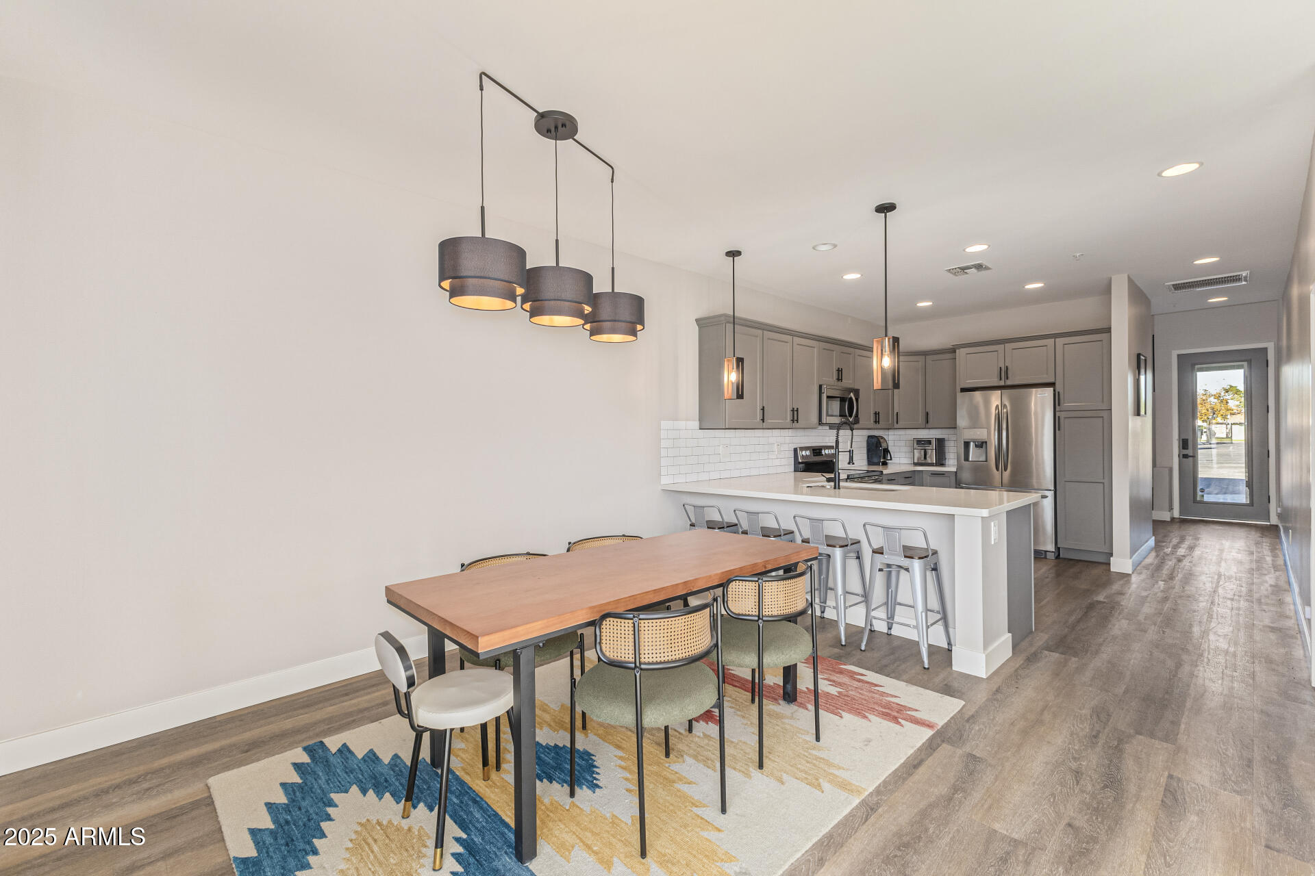 2315 East Pinchot Avenue, Unit 113 Phoenix, AZ 85016 - Photo 19 of 54 a kitchen with a table and chairs in it