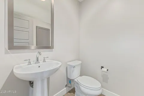 a bedroom with a bed and a walk in closet