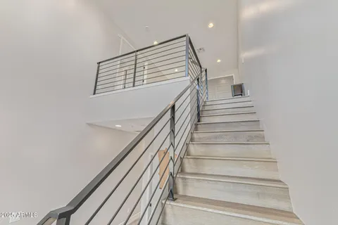 a bedroom with a bed and a walk in closet