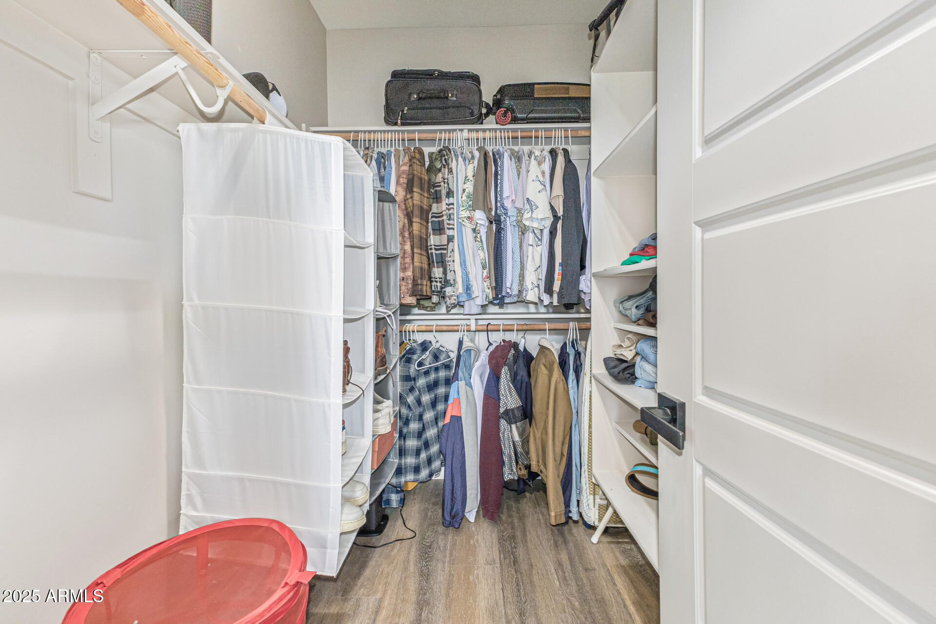 2315 East Pinchot Avenue, Unit 113 Phoenix, AZ 85016 - Photo 29 of 54 a view of walk in closet with clothes and shoes