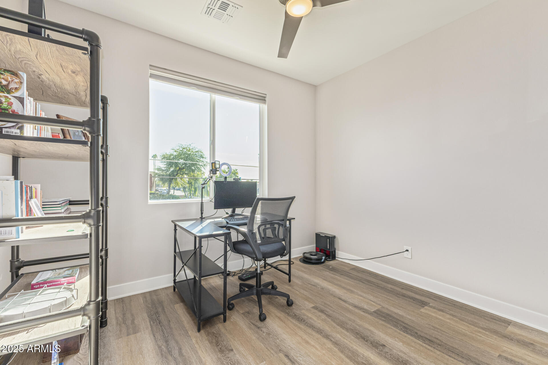 2315 East Pinchot Avenue, Unit 113 Phoenix, AZ 85016 - Photo 30 of 54 a workspace with wooden floor