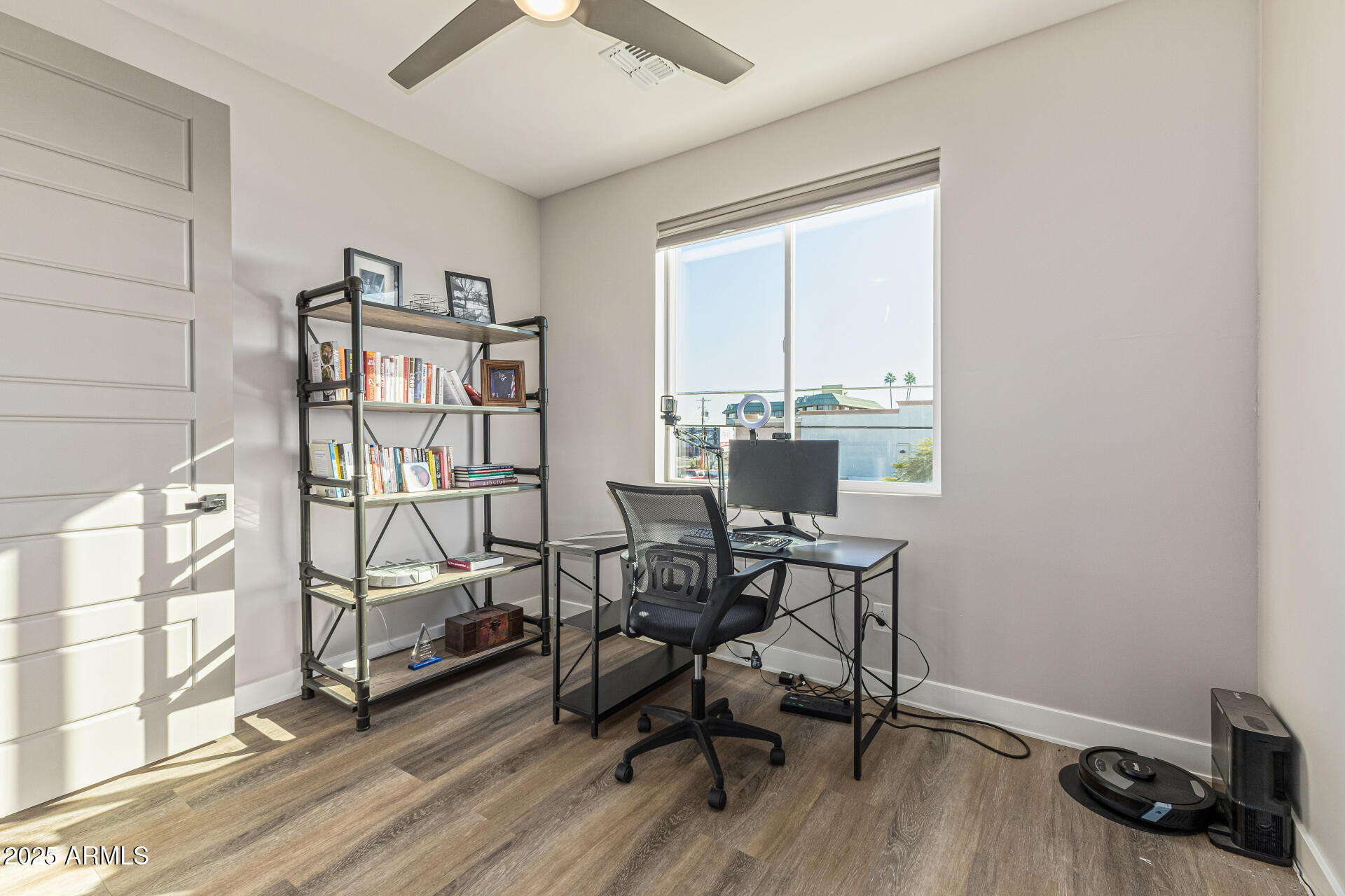 2315 East Pinchot Avenue, Unit 113 Phoenix, AZ 85016 - Photo 31 of 54 a workspace with wooden floor and a window