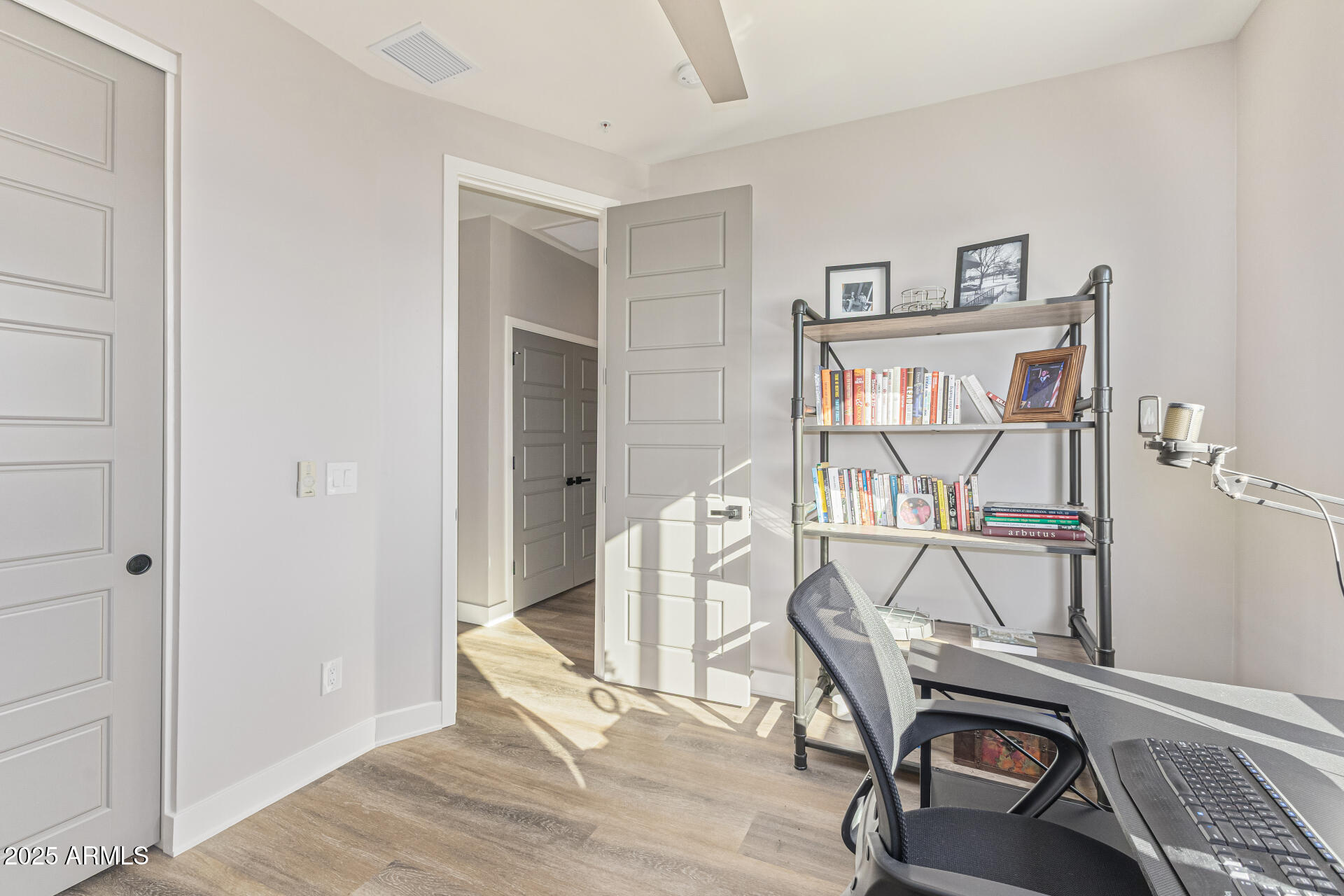 2315 East Pinchot Avenue, Unit 113 Phoenix, AZ 85016 - Photo 32 of 54 a view of a workspace with furniture and wooden floor