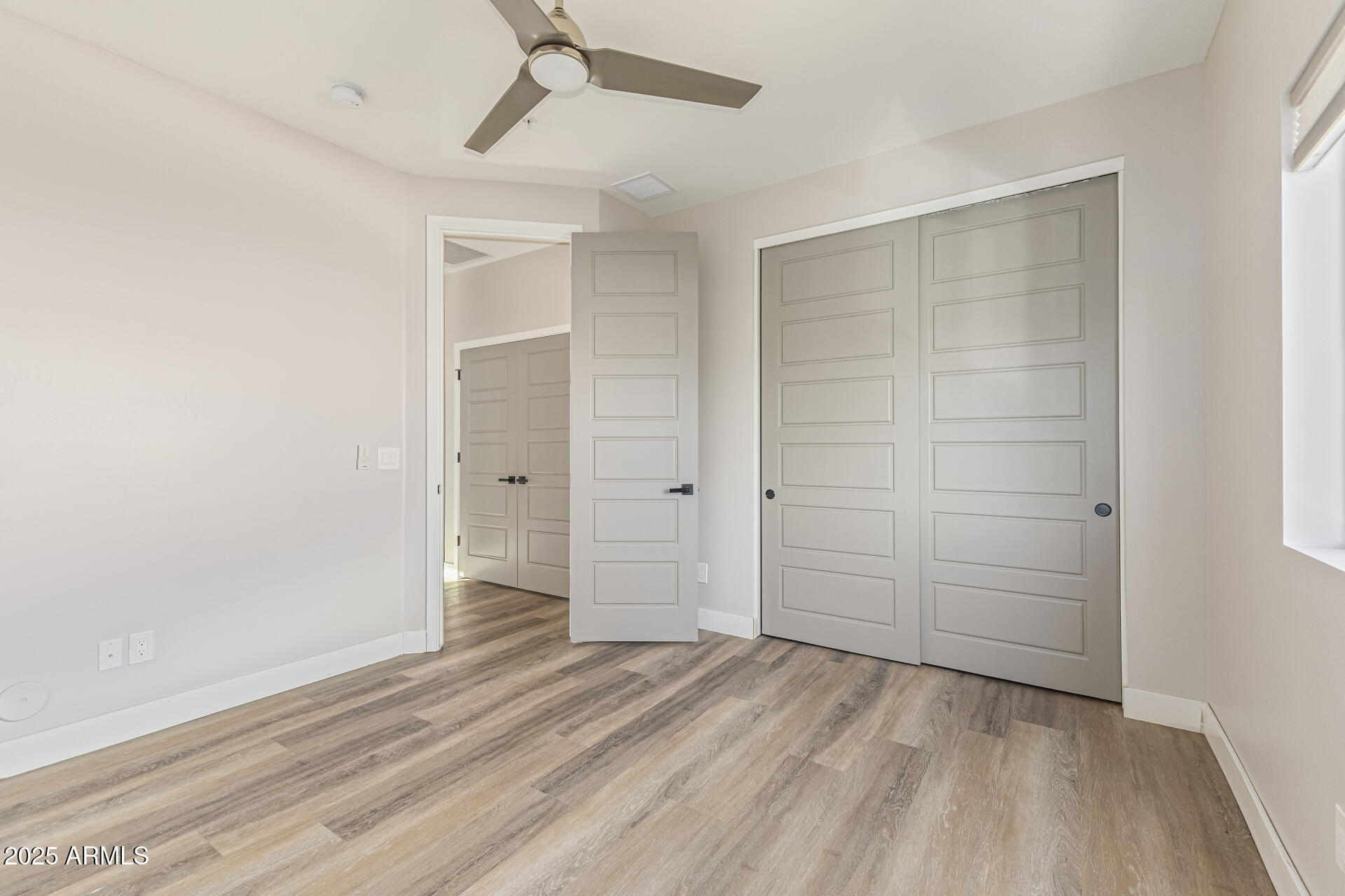 2315 East Pinchot Avenue, Unit 113 Phoenix, AZ 85016 - Photo 36 of 54 an empty room with closet