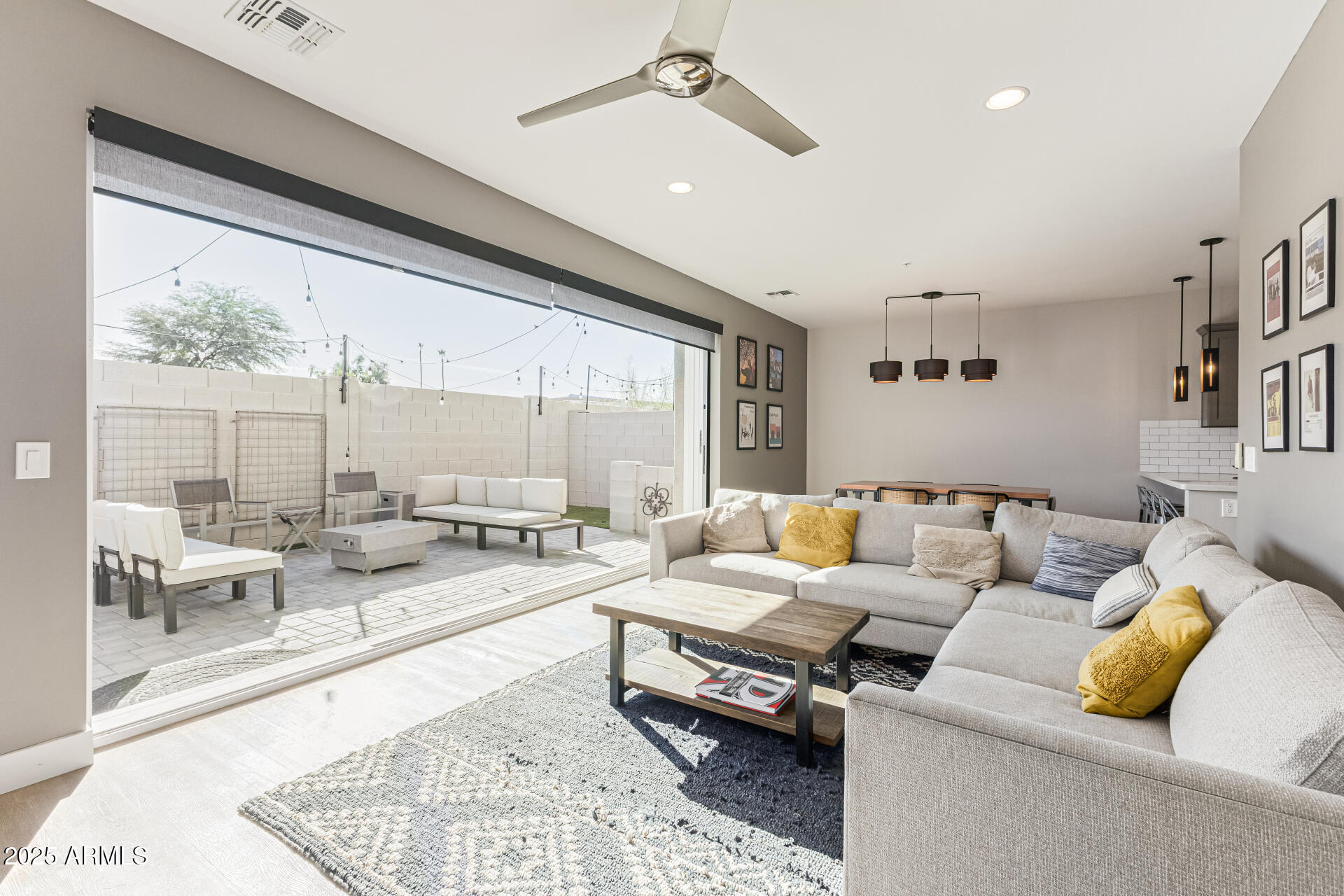 2315 East Pinchot Avenue, Unit 113 Phoenix, AZ 85016 - Photo 4 of 54 a living room with furniture and a large window