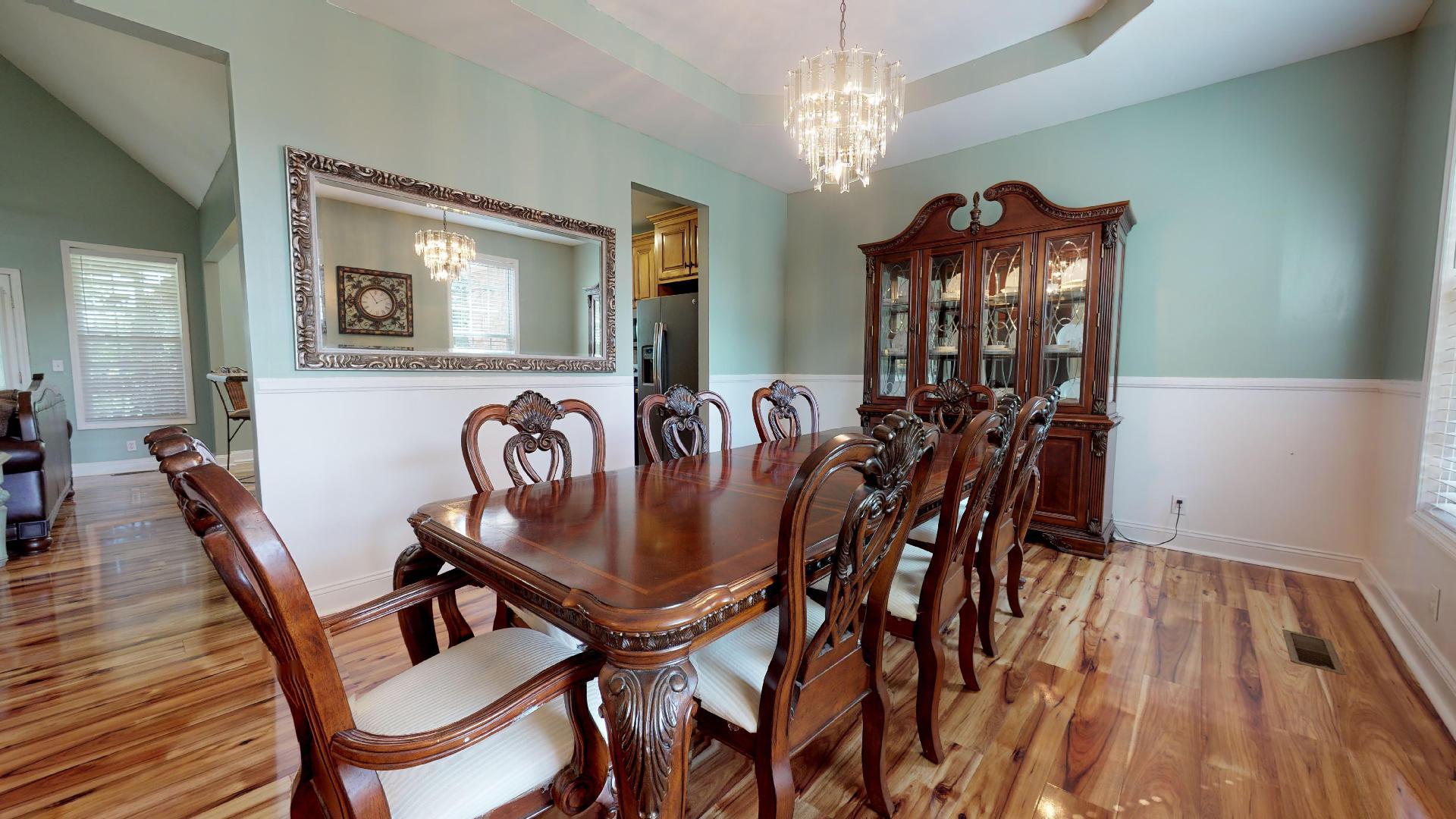 1489 Newman Road Prospect, TN 38477 - Photo 3 of 23 a view of a dining room with furniture and chandelier