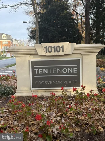 a sign that is in front of flowers