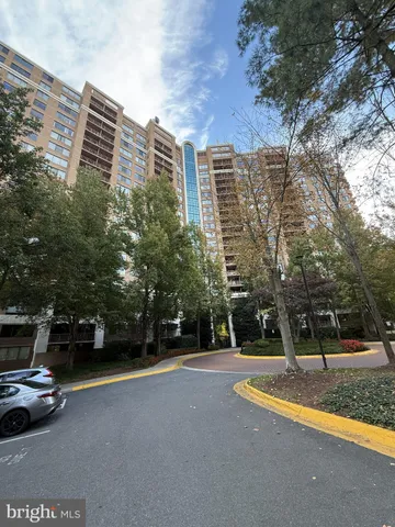 a view of street with tall buildings