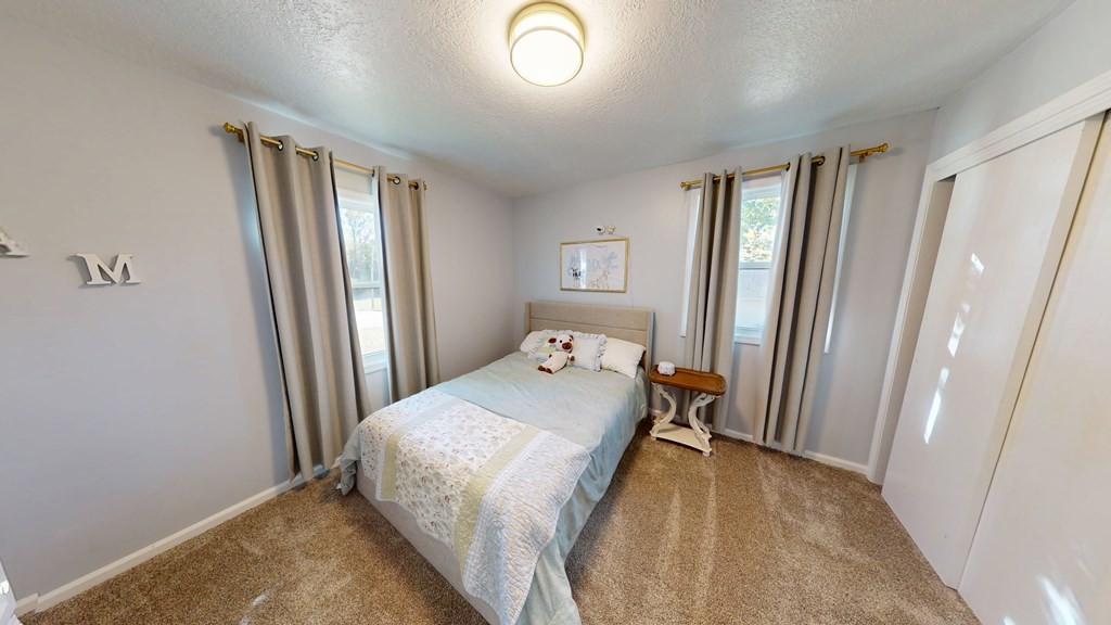 506 Lankford Road Paris, TN 38242 - Photo 11 of 23 a bedroom with a bed and a window