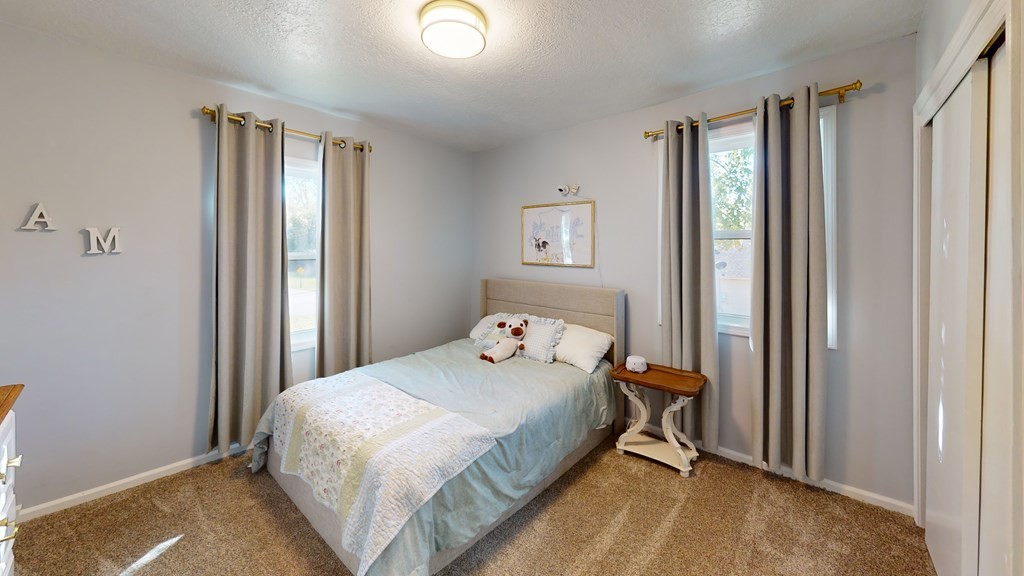 506 Lankford Road Paris, TN 38242 - Photo 15 of 23 a bedroom with a bed and a window