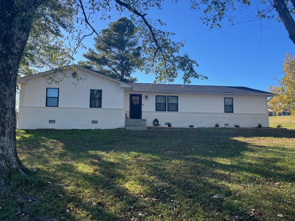 506 Lankford Road Paris, TN 38242 - Photo 23 of 23 a backyard of a house with plants and large tree