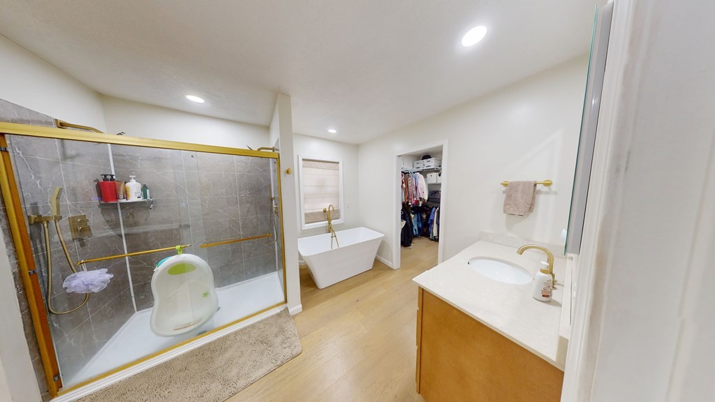 506 Lankford Road Paris, TN 38242 - Photo 8 of 23 a en suite bathroom with a granite countertop tub a sink and glass door