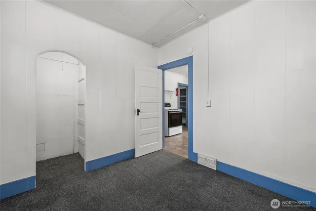 a white toilet sitting next to a bath tub