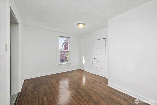 a kitchen with stainless steel appliances granite countertop a refrigerator a stove and a sink