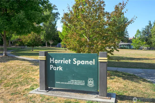a view of a street with a building and trees