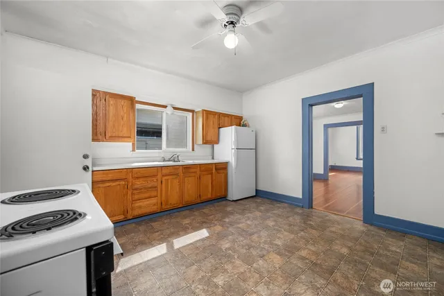 a kitchen with stainless steel appliances a stove sink and cabinets