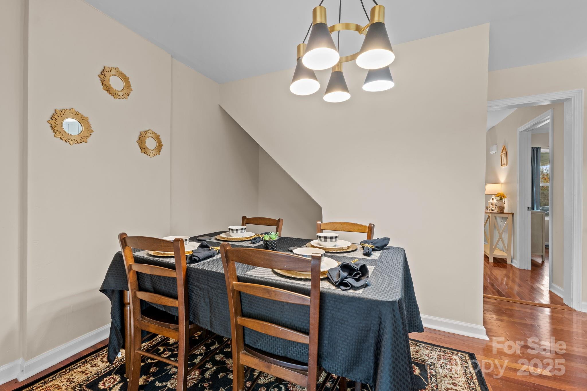 2337 Belmont Road Linwood, NC 27299 - Photo 11 of 46 a view of a dining room with furniture and wooden floor
