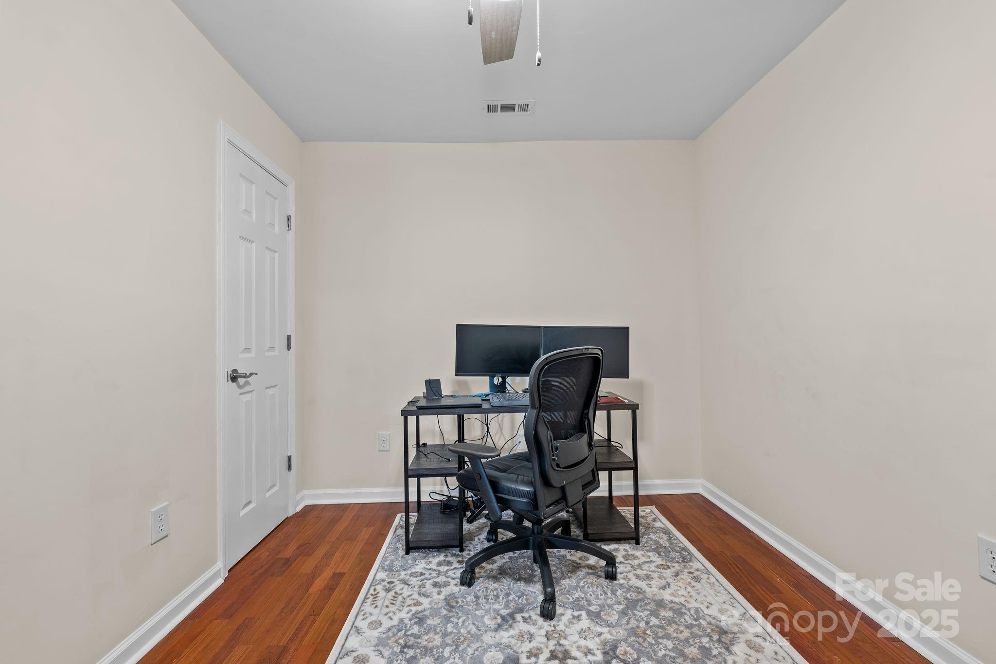 2337 Belmont Road Linwood, NC 27299 - Photo 15 of 46 a view of a workspace with furniture and wooden floor