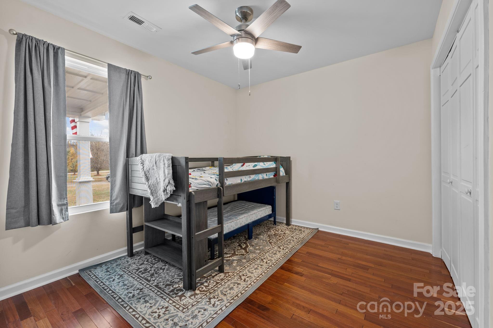 2337 Belmont Road Linwood, NC 27299 - Photo 16 of 46 a bedroom with furniture and a window